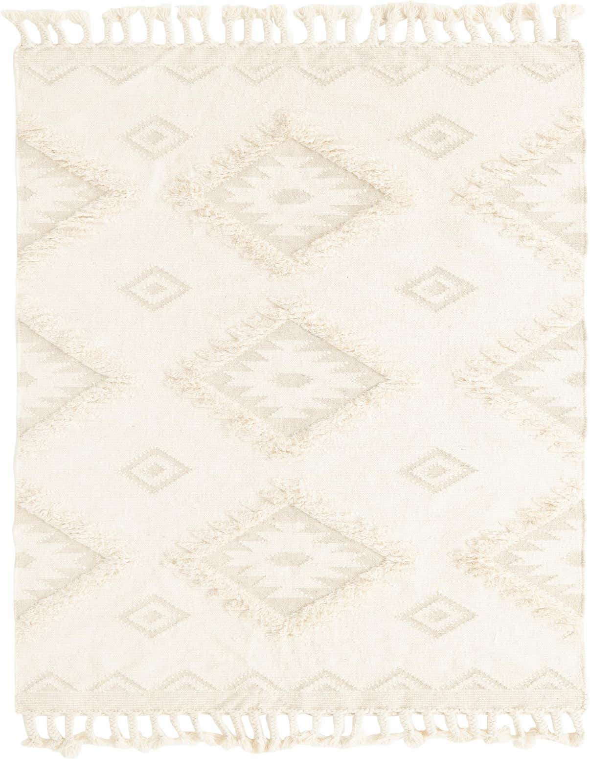 A 6x9 rectangular ivory wool rug with a bohemian tribal pattern and shag texture, featuring tassels.