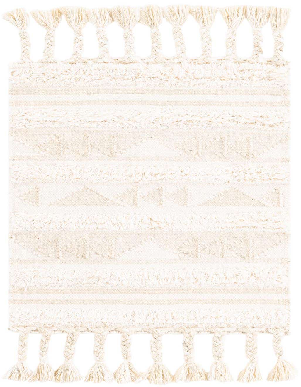A 2x3 rectangular ivory and cream tribal rug with textured shag pile and braided tassels.