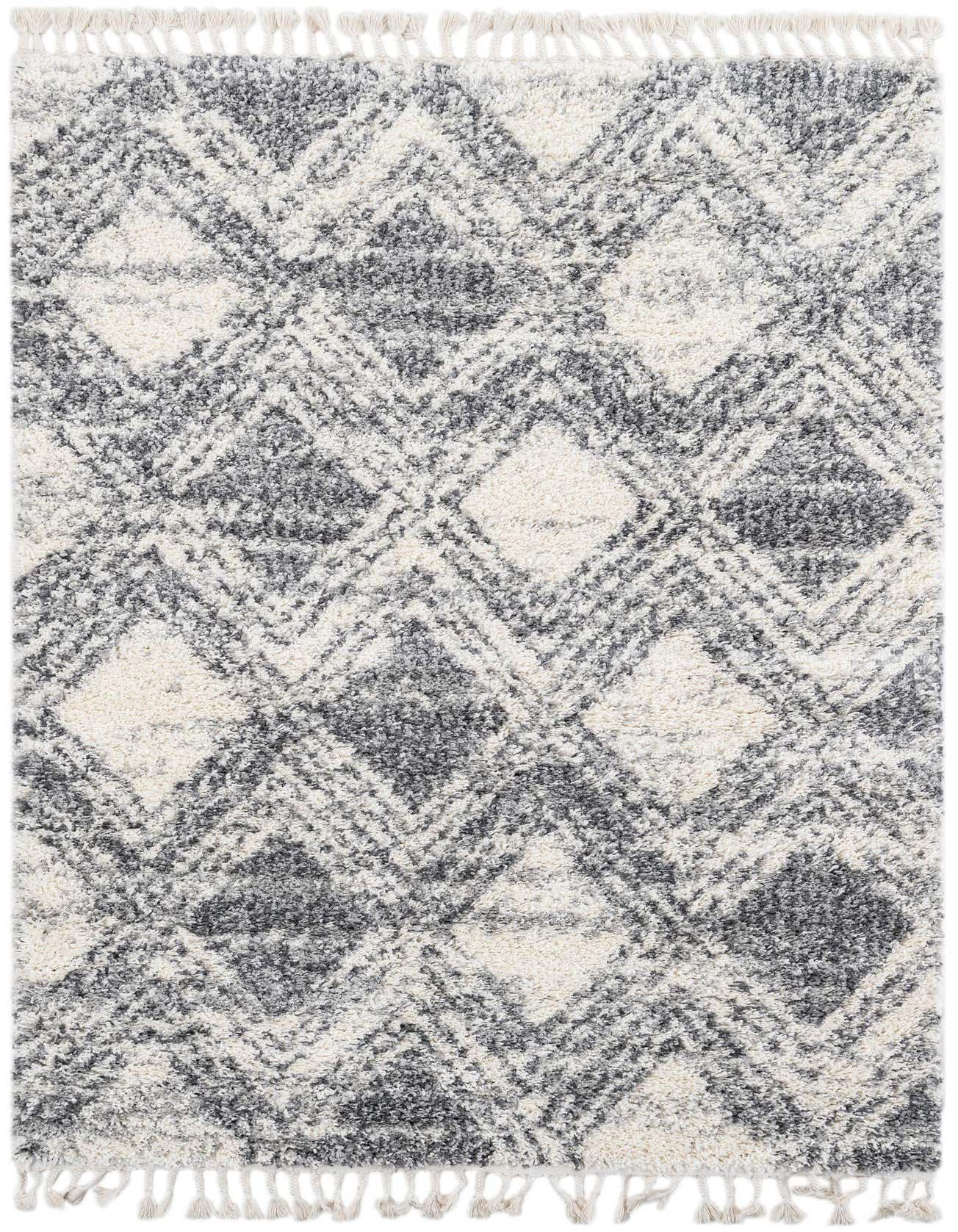 A 5x8 rectangular Athena Shag rug in ivory and cream with a modern geometric diamond pattern and fringe.