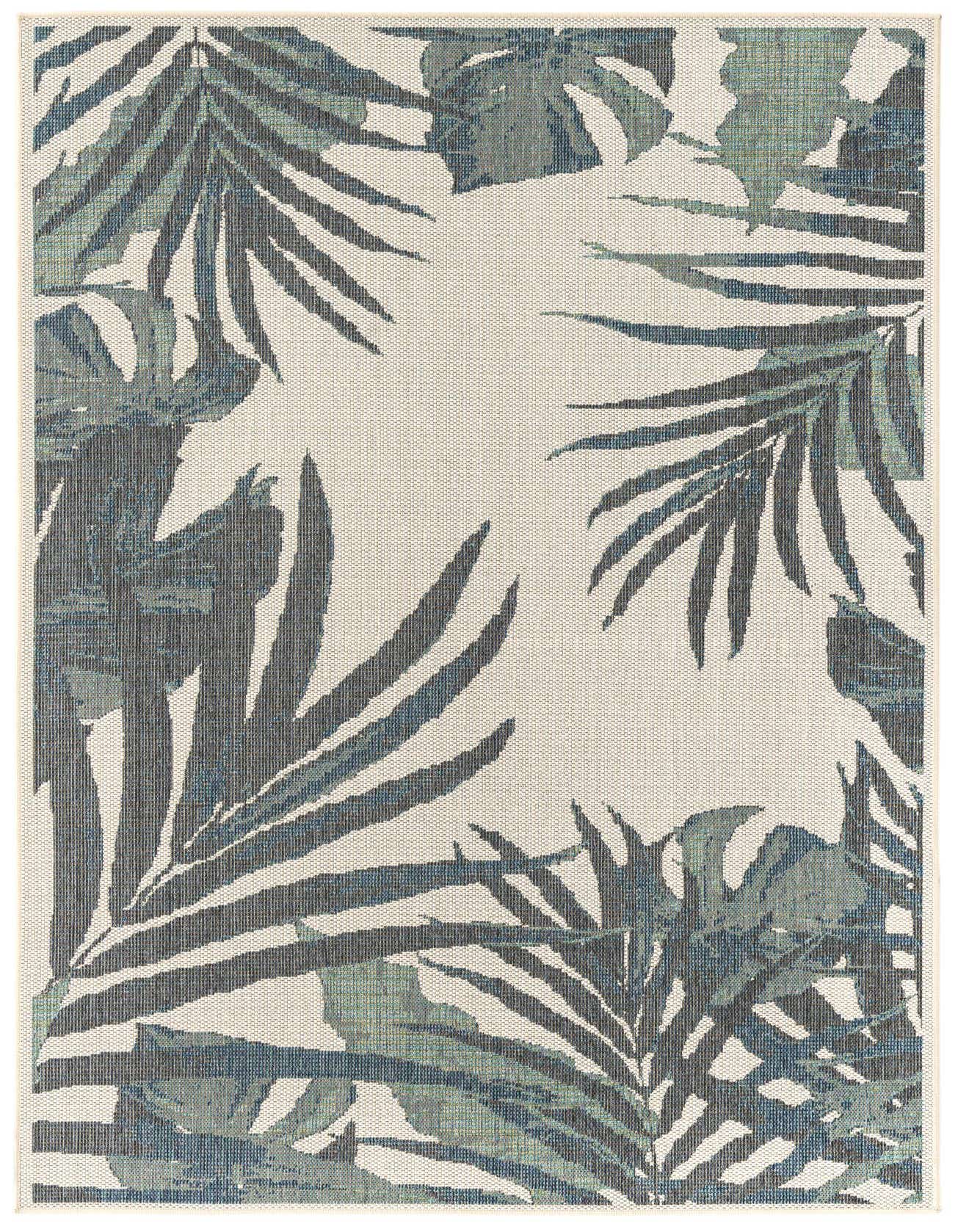 A 6x9 rectangular ivory flatweave rug with a modern botanical pattern of large blue and green palm leaves.