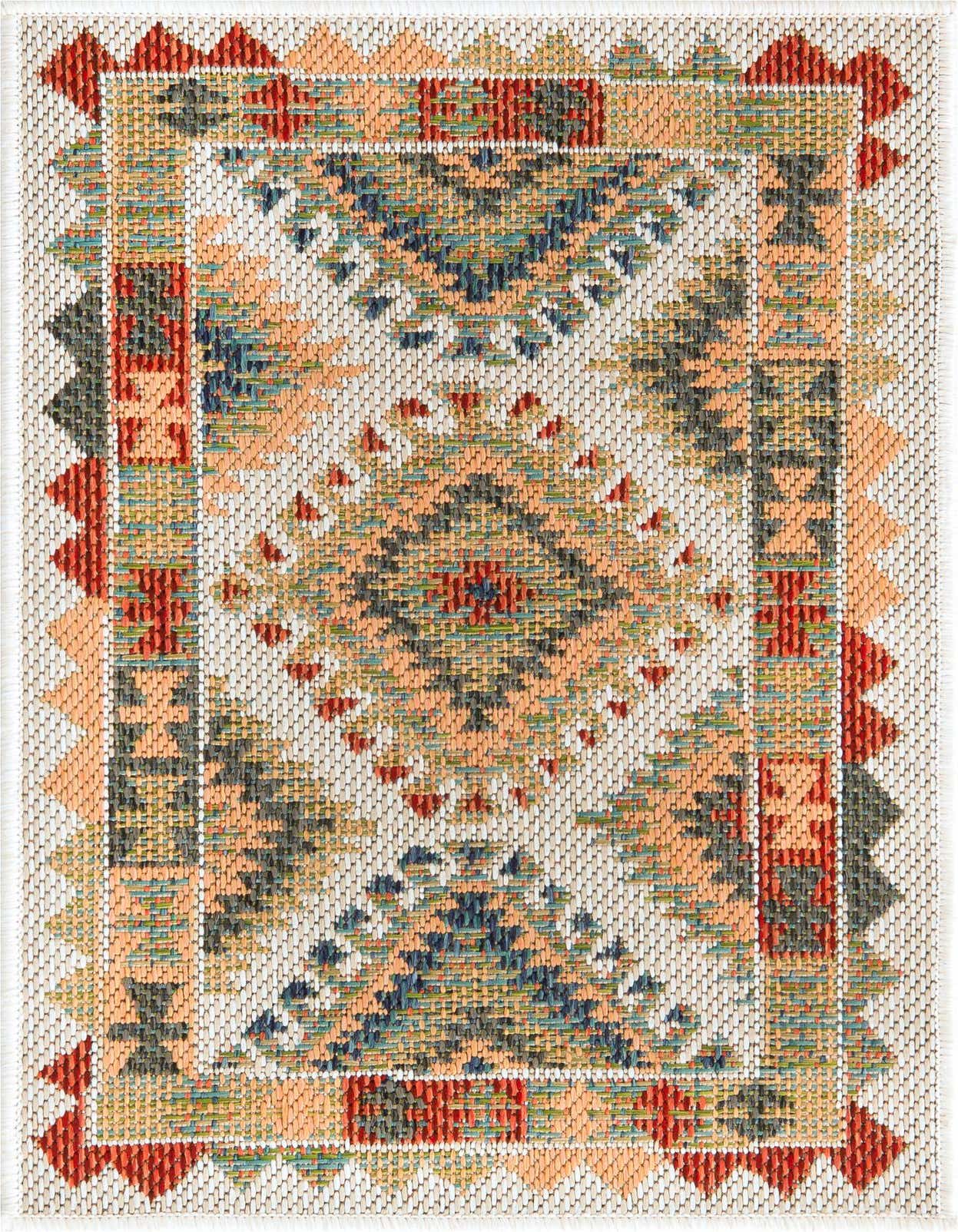 A 2x3 rectangular Baja Outdoor rug featuring a Southwestern medallion pattern in ivory, cream, orange, blue, and red tones, suitable for indoor or outdoor use.