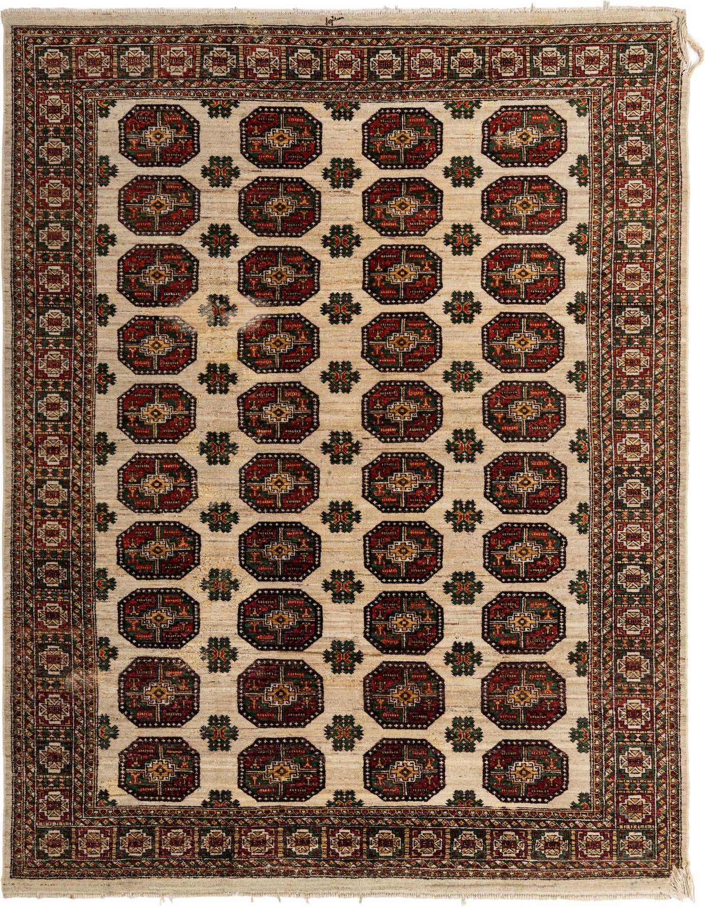A 6x9 rectangular ivory Balouch rug featuring a traditional tribal pattern with octagonal medallions in red, green, and gold.