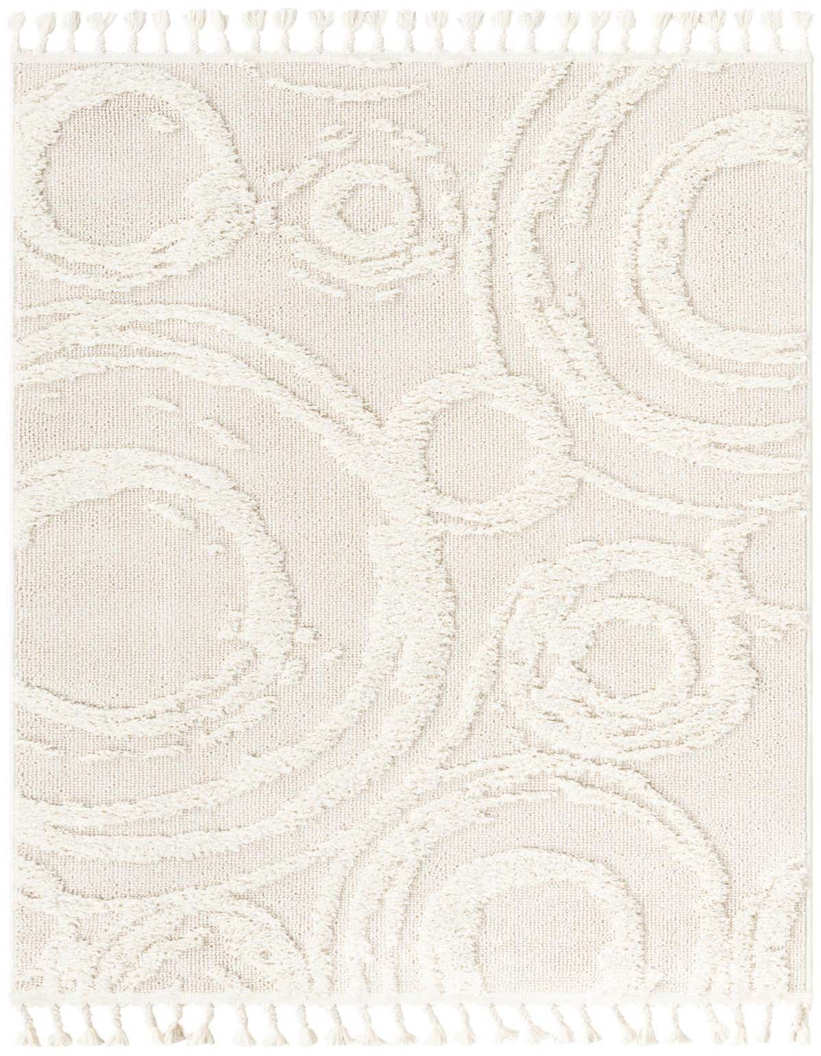 A 2x3 rectangular ivory rug with a textured, high-pile abstract bohemian pattern featuring swirling shapes and tassels.