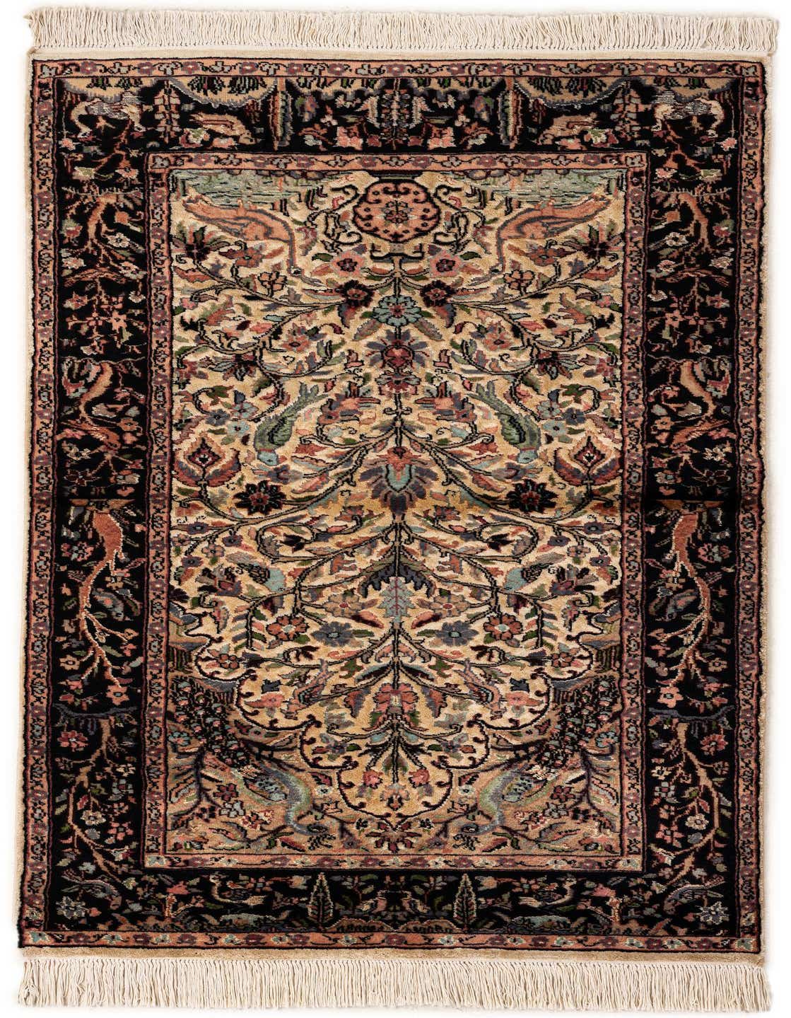A 3x5 rectangular ivory and black Bokhara rug with a traditional tribal medallion pattern and fringe.