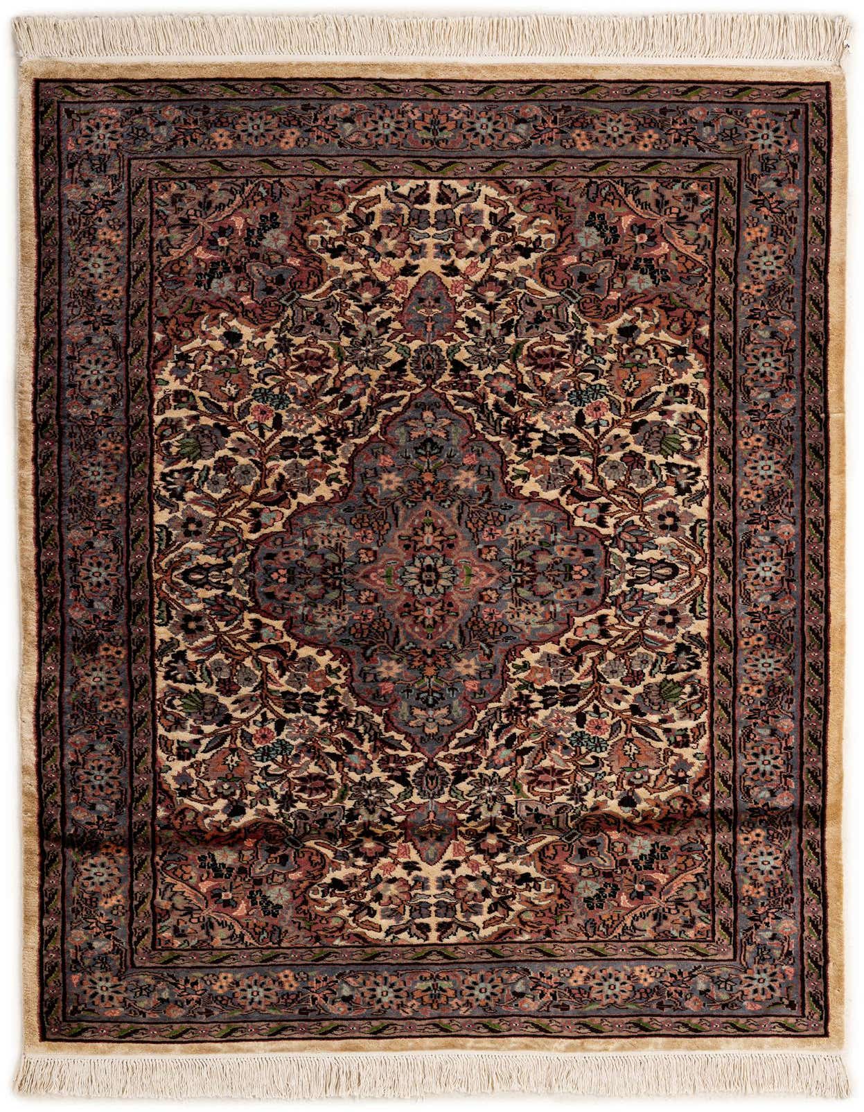 A 4x6 rectangular ivory Bokhara rug with a traditional medallion and intricate floral tribal patterns, featuring fringe.
