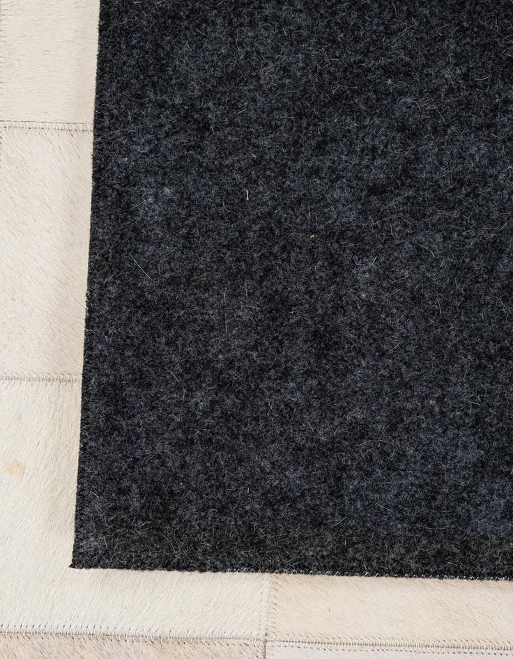 Detail image of  5' 1 x 7' 11 Cowhide - Patchwork Rug