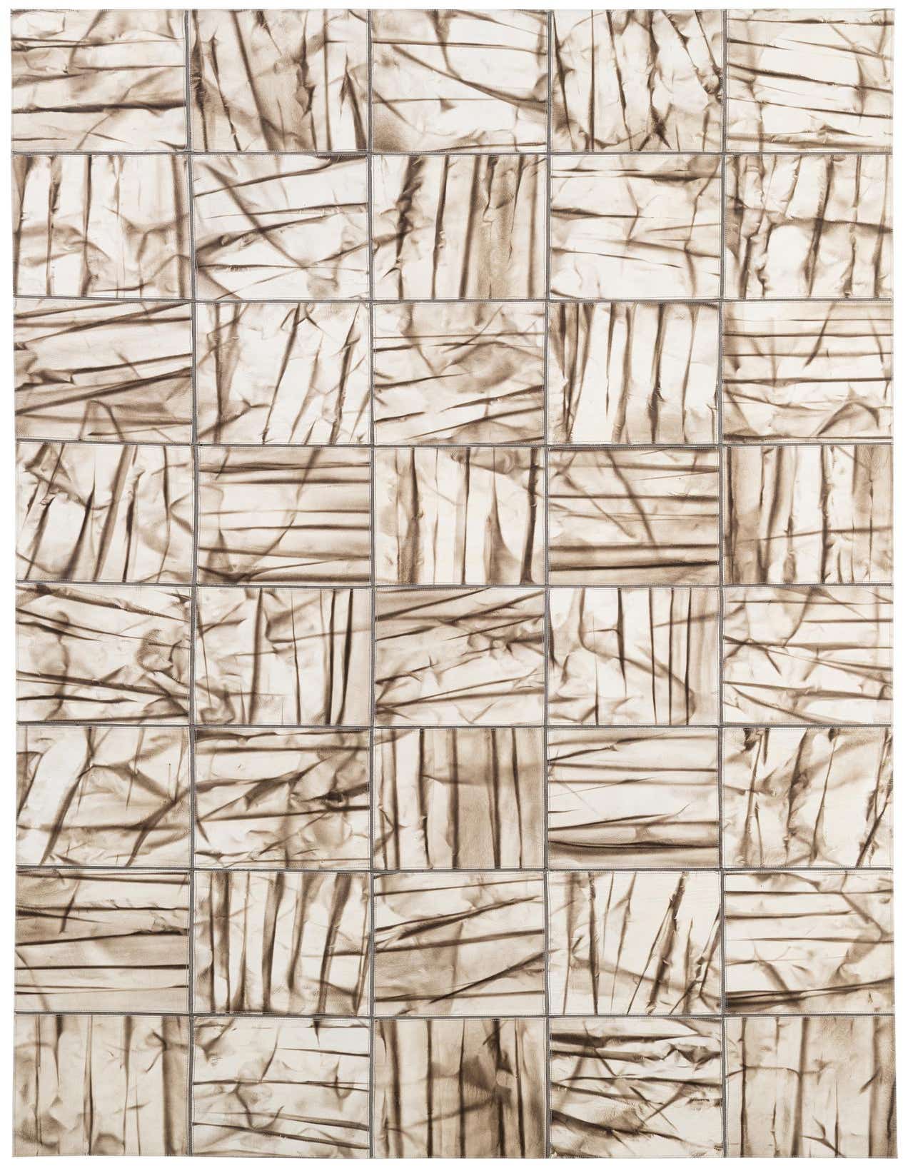 A 5x8 rectangular Cowhide - Patchwork rug featuring a modern, abstract design in shades of ivory and cream, ideal for a living room.