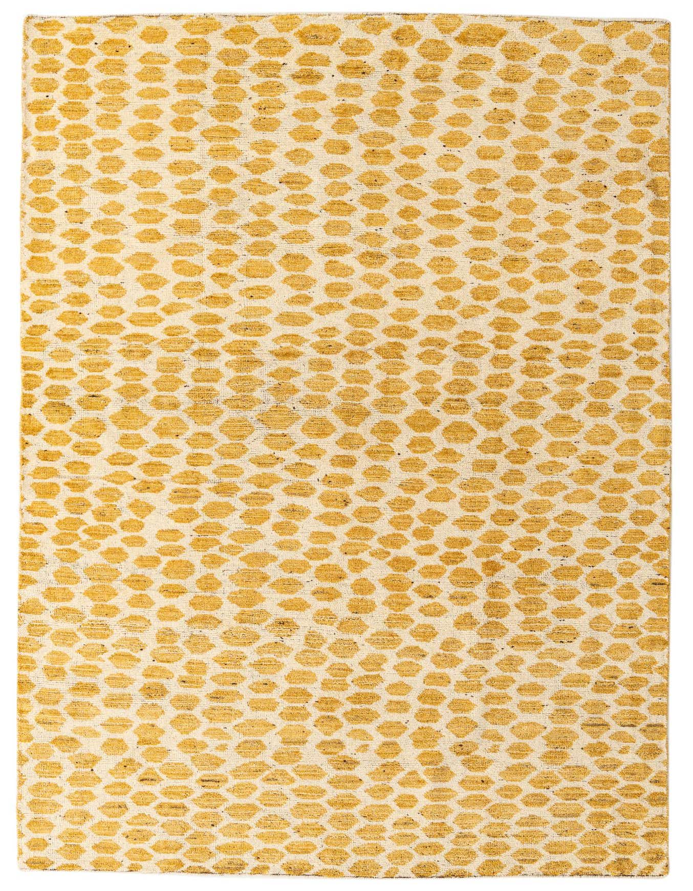 A 6x9 rectangular ivory and cream wool rug with a modern abstract pattern of textured gold dots.