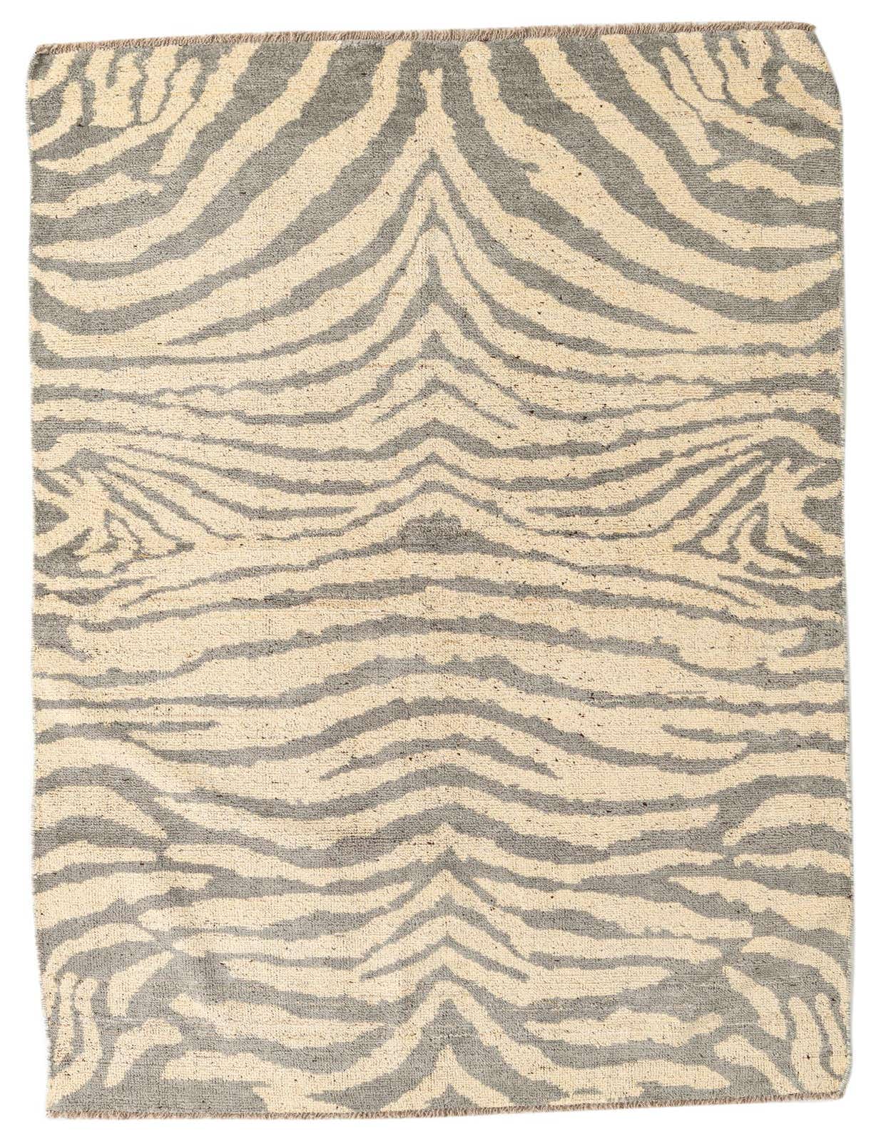A 5x8 rectangular Darya rug with an abstract modern pattern in ivory and gray, made from high-pile wool.