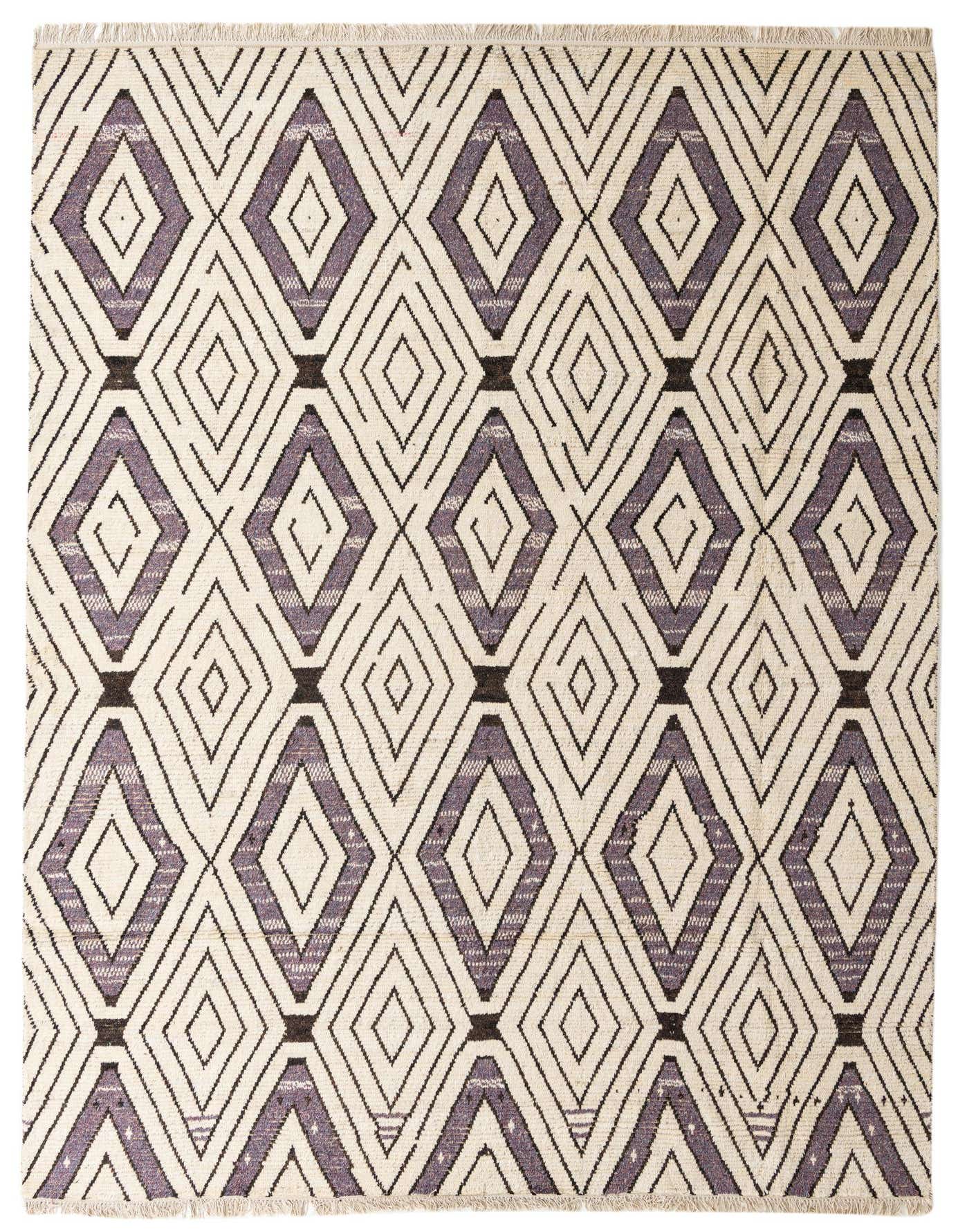 A 10x14 rectangular ivory wool rug with a modern abstract pattern of interlocking diamonds in shades of cream, white, and subtle purple.