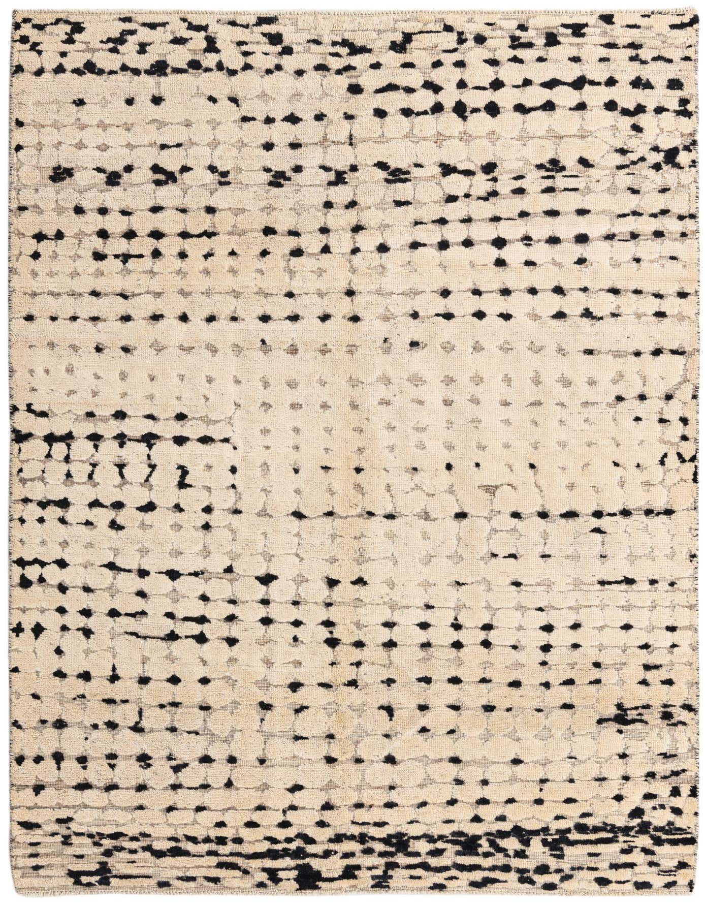 A 5x8 rectangular Darya rug in ivory and black, featuring an abstract, modern pattern of textured dots and dashes.