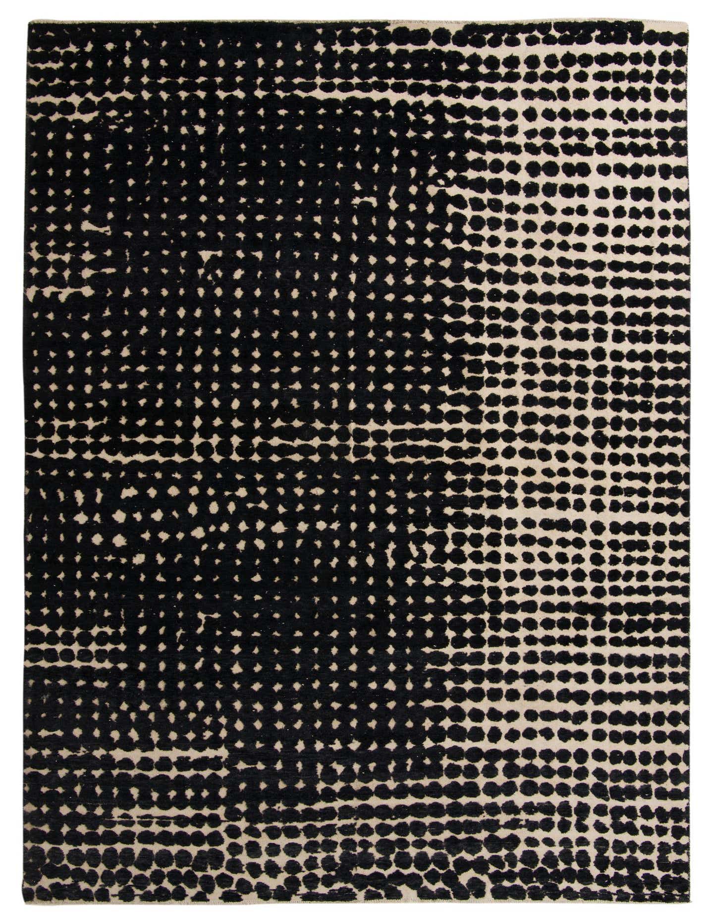 A 10x14 rectangular Darya rug with a modern black and cream dotted pattern, handmade from wool.