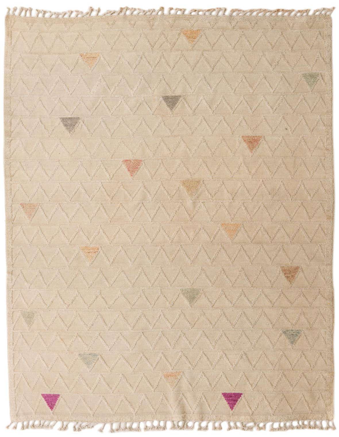 A 6x9 rectangular ivory wool rug with a modern abstract pattern of textured zigzags and scattered colorful triangles.