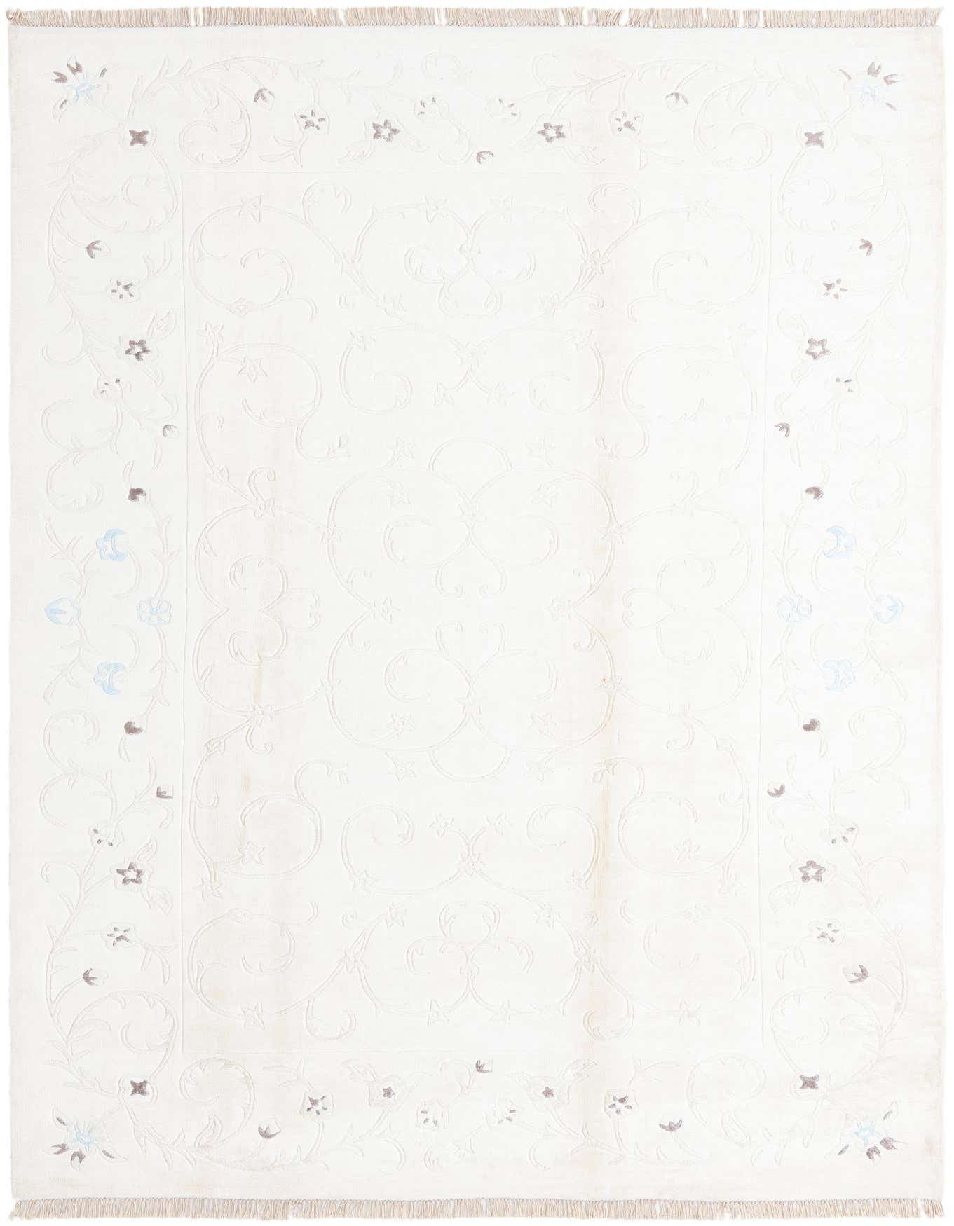 A 7x10 rectangular ivory and cream wool and silk rug with a subtle modern oriental floral pattern and fringe.