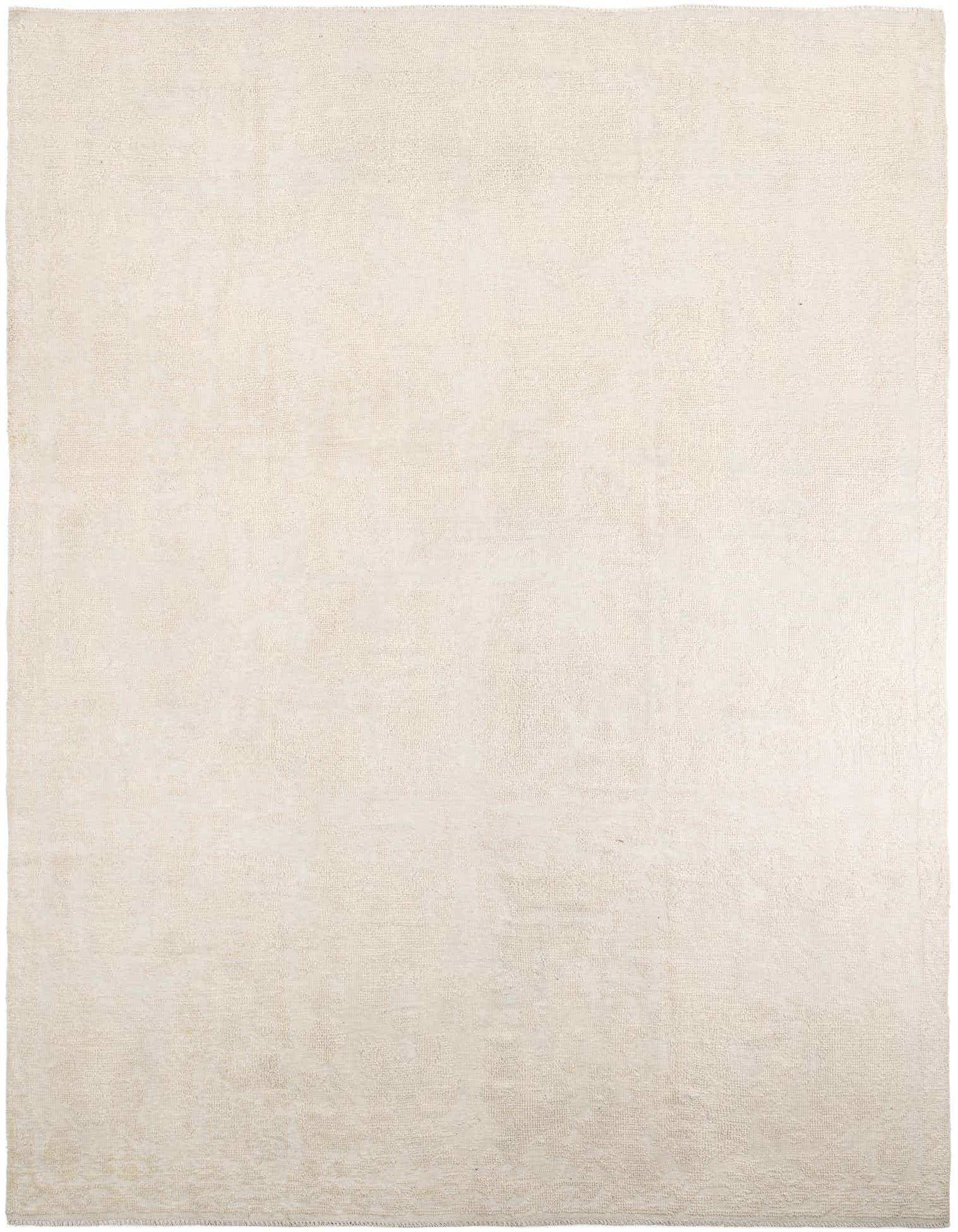 A large 9x12 rectangular ivory wool area rug with a subtle modern abstract pattern, suitable for a living room.