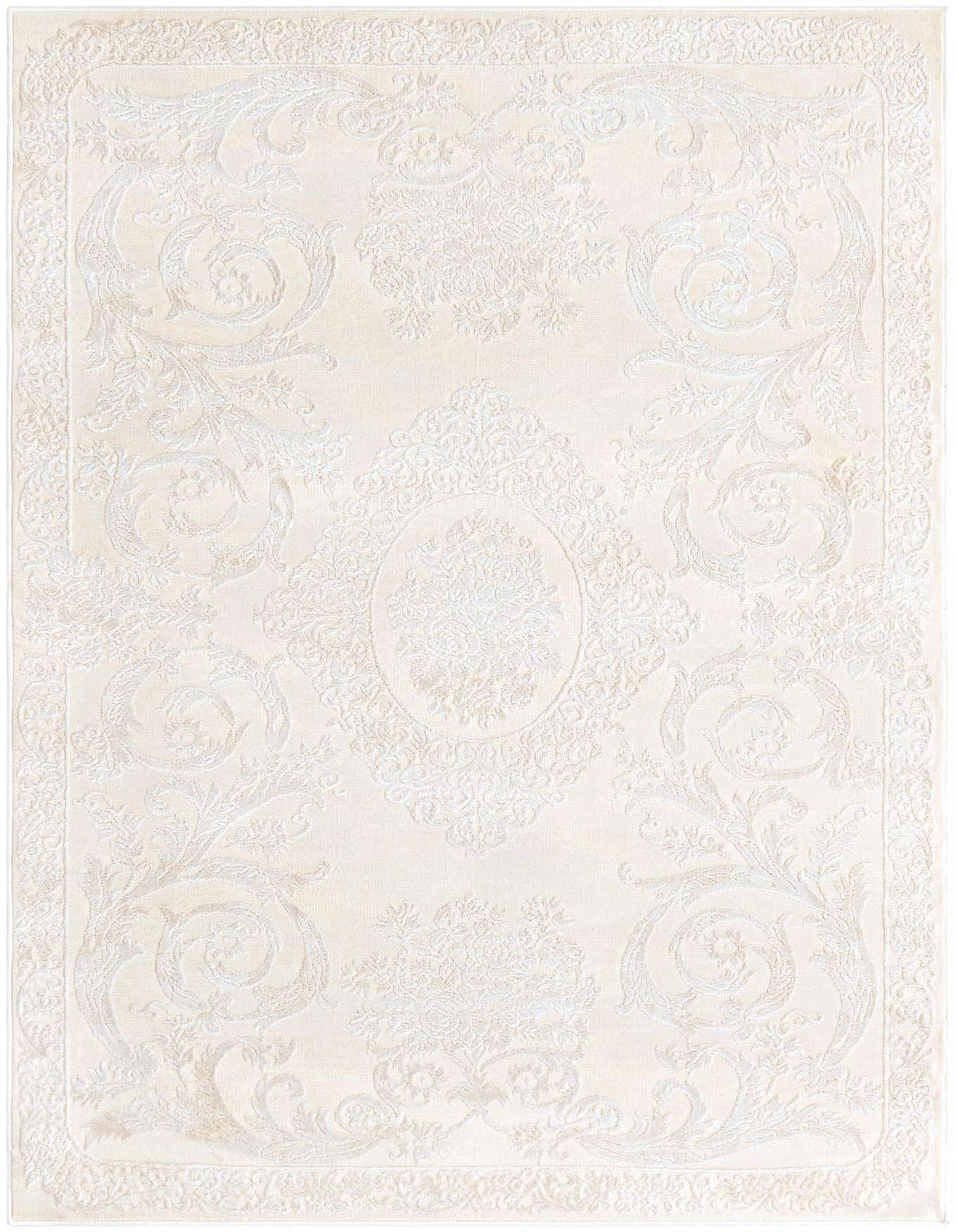 A 4x6 rectangular ivory and cream rug with a subtle raised traditional medallion and floral pattern, featuring a textured high-low pile.