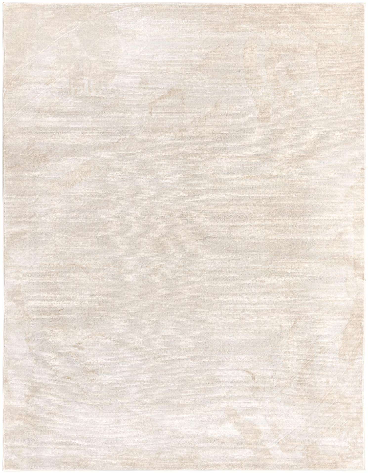 A 7x10 rectangular ivory and cream transitional area rug with a subtle textured high-low pile.