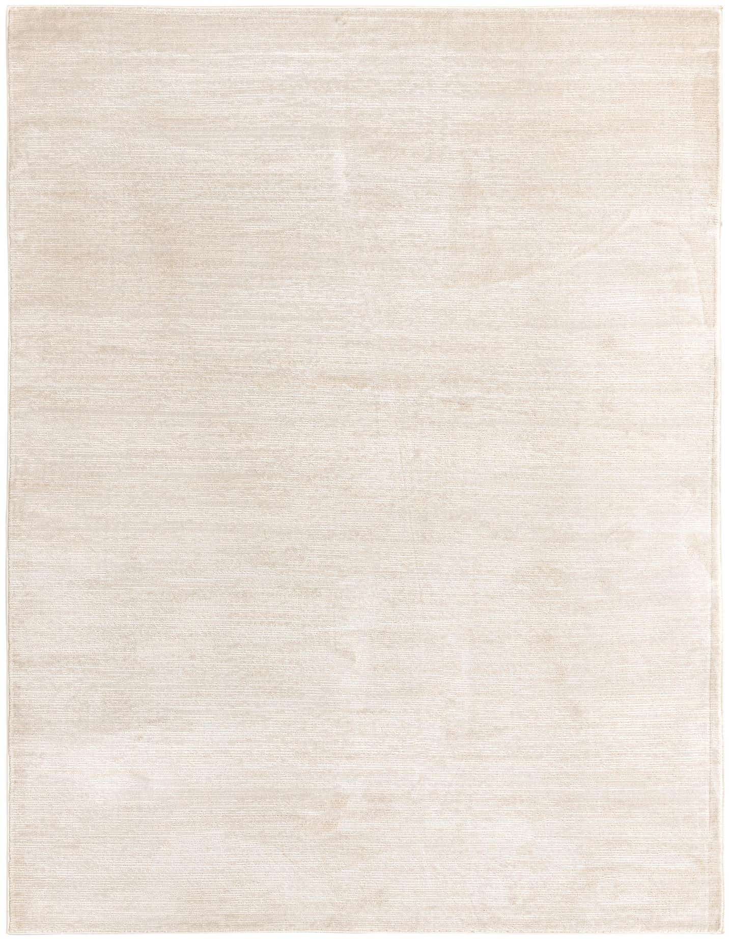 A 6x9 rectangular ivory and cream area rug with a subtle high/low textured pile, perfect for a living room.