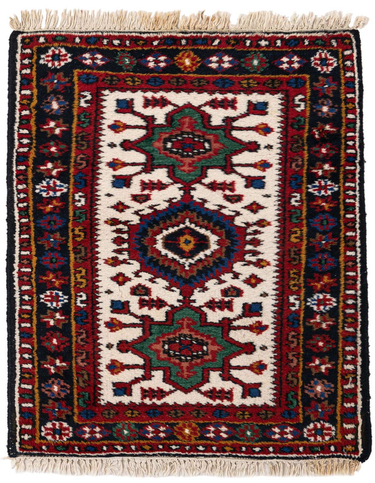 A 2x3 rectangular Hamedan tribal wool rug featuring a central ivory field with geometric motifs in red, blue, green, and black, framed by a dark border with intricate patterns, and finished with fringe.