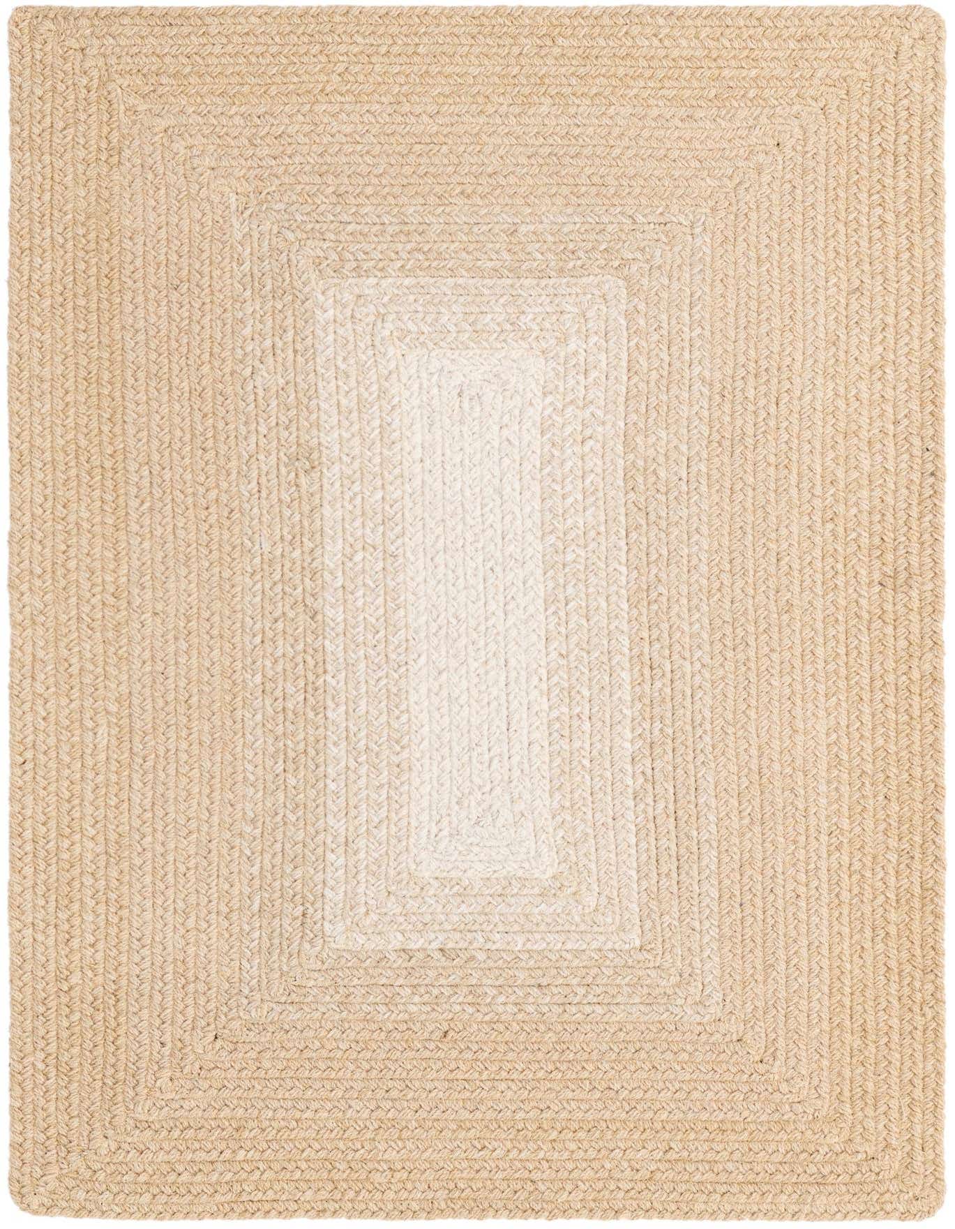 A 2x3 rectangular hand-braided wool rug with a modern design, featuring a natural ivory border fading to a lighter cream center.