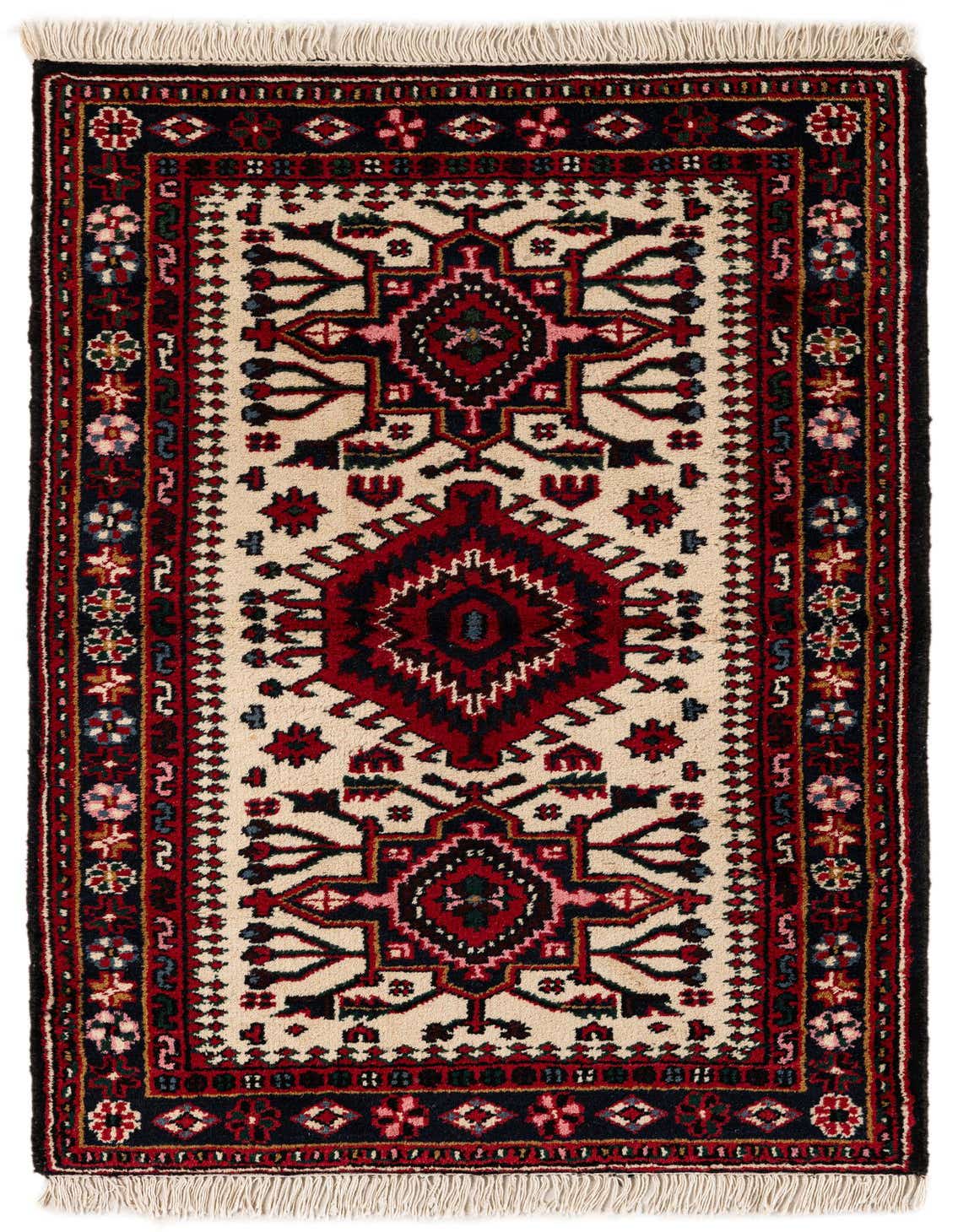 A 3x5 rectangular Heriz rug featuring a traditional Oriental medallion pattern in ivory, red, and navy with fringe.