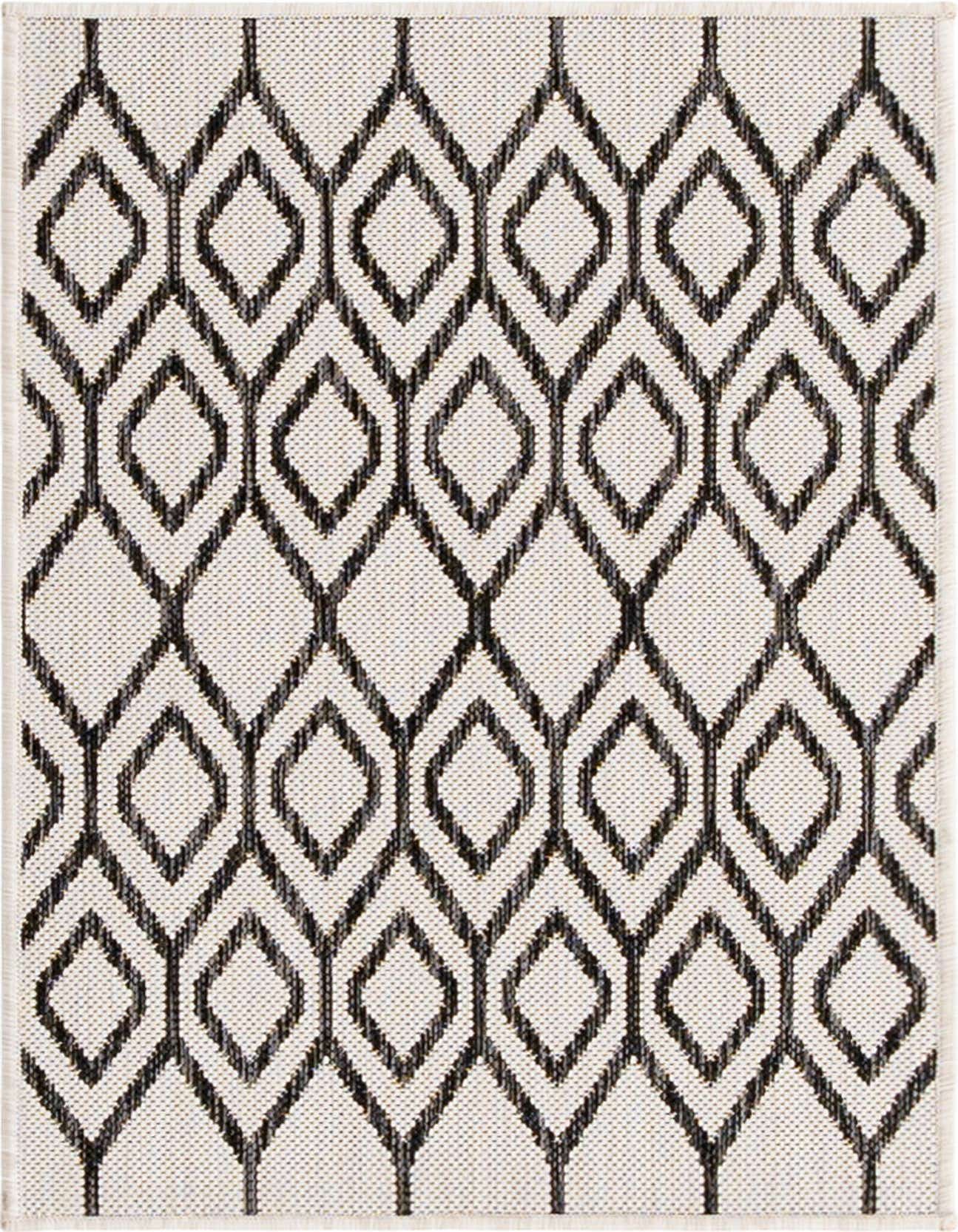 A 2x3 rectangular Jill Zarin Outdoor rug featuring an ivory background with a bold black tribal trellis pattern, suitable for a patio.