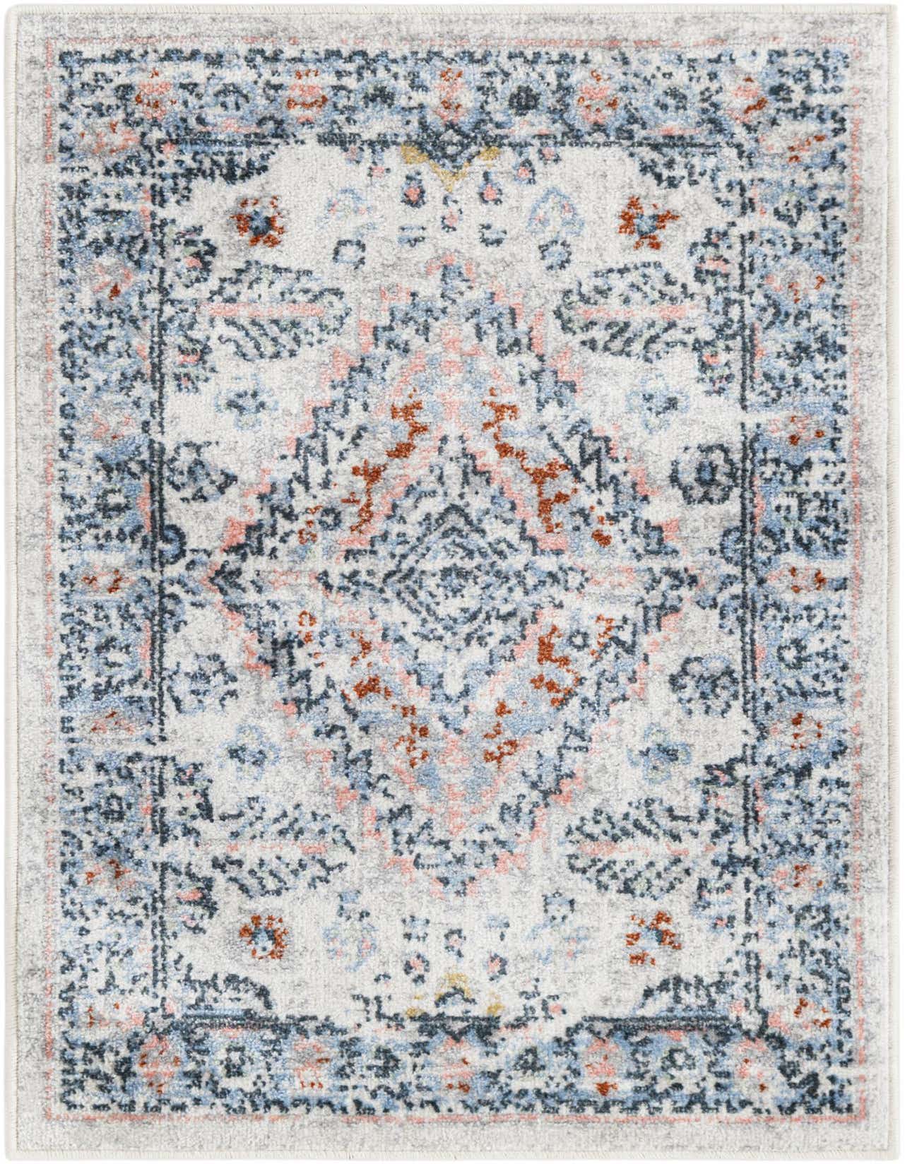 A 2x3 rectangular Kamala Washable rug featuring a distressed traditional medallion pattern in ivory, light blue, rust, and subtle pink tones.