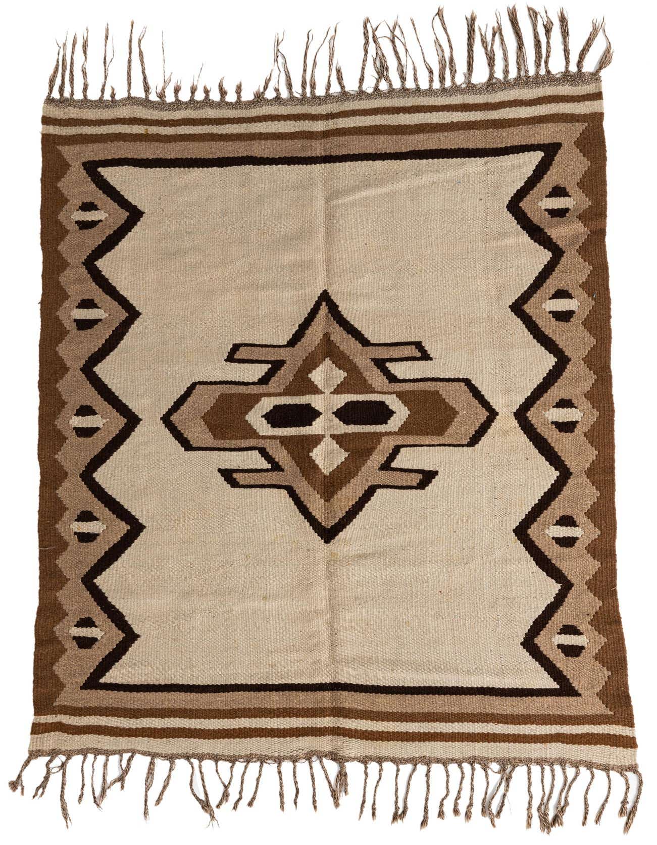 A 4x6 rectangular Kilim Fars wool rug featuring a tribal medallion in shades of brown and cream on an ivory background, with fringed ends.