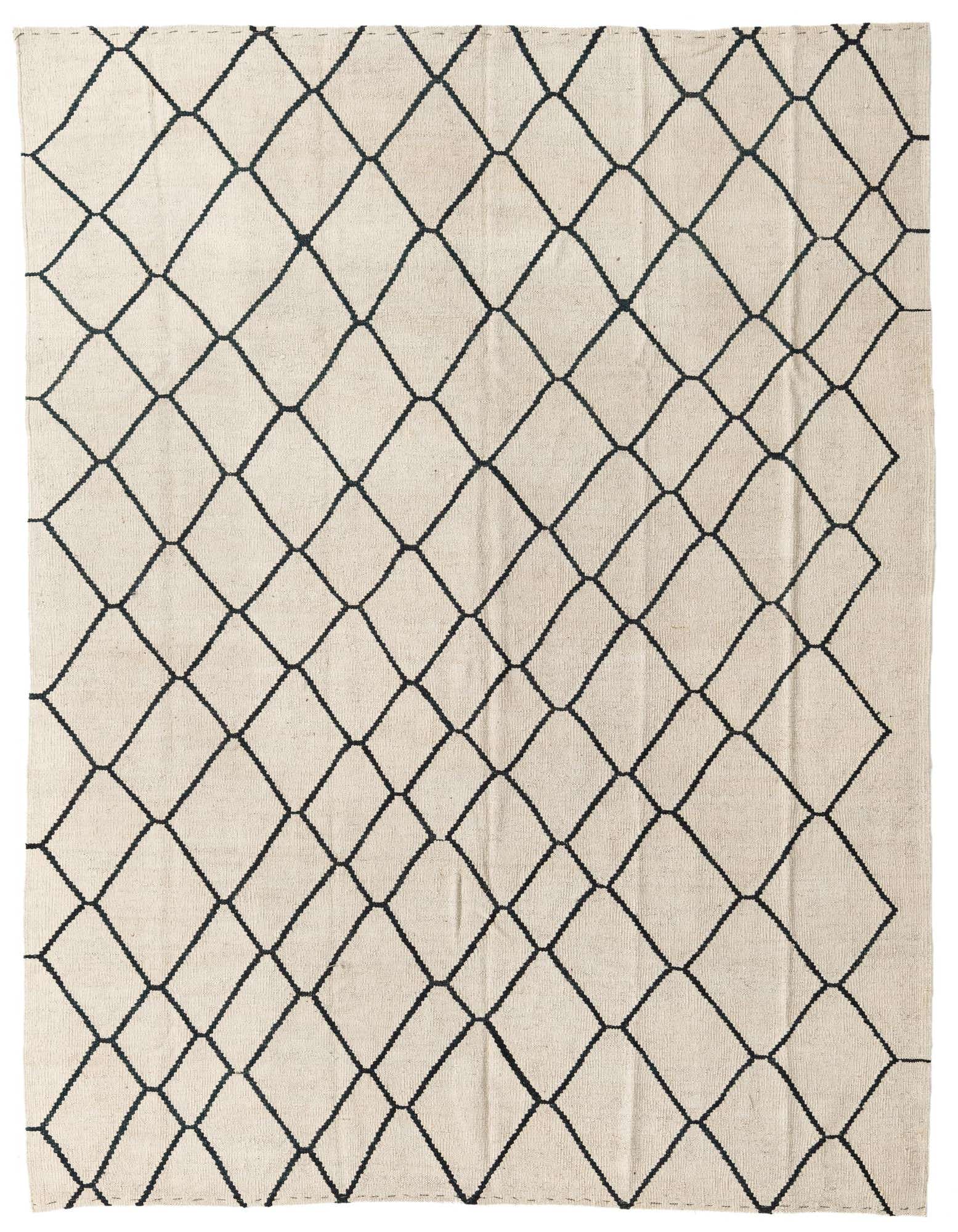 A 6x9 rectangular ivory flatweave wool rug with a black tribal diamond pattern, perfect for a modern living room.