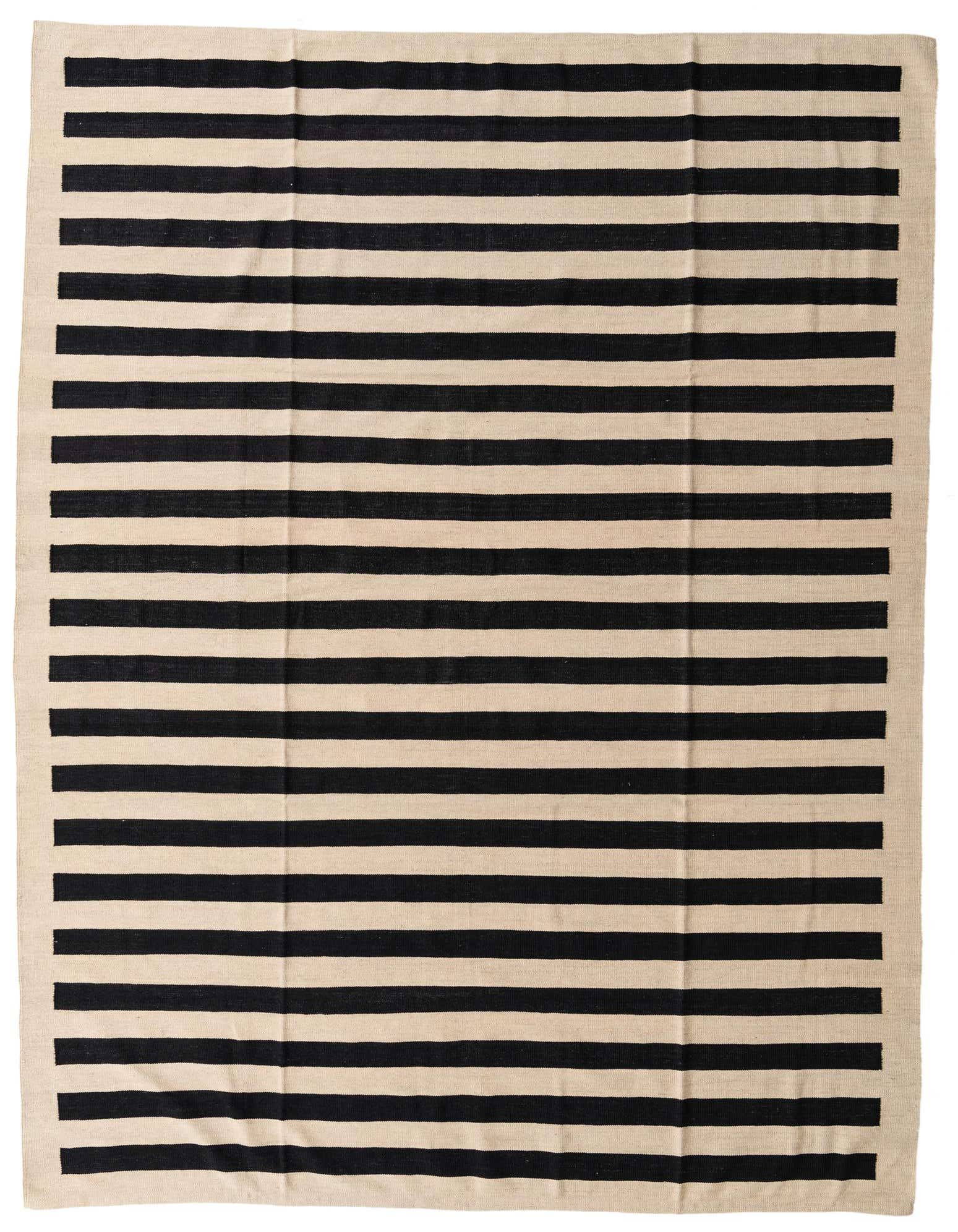 A large 8x11 rectangular ivory and black striped flatweave rug, ideal for a modern living room.