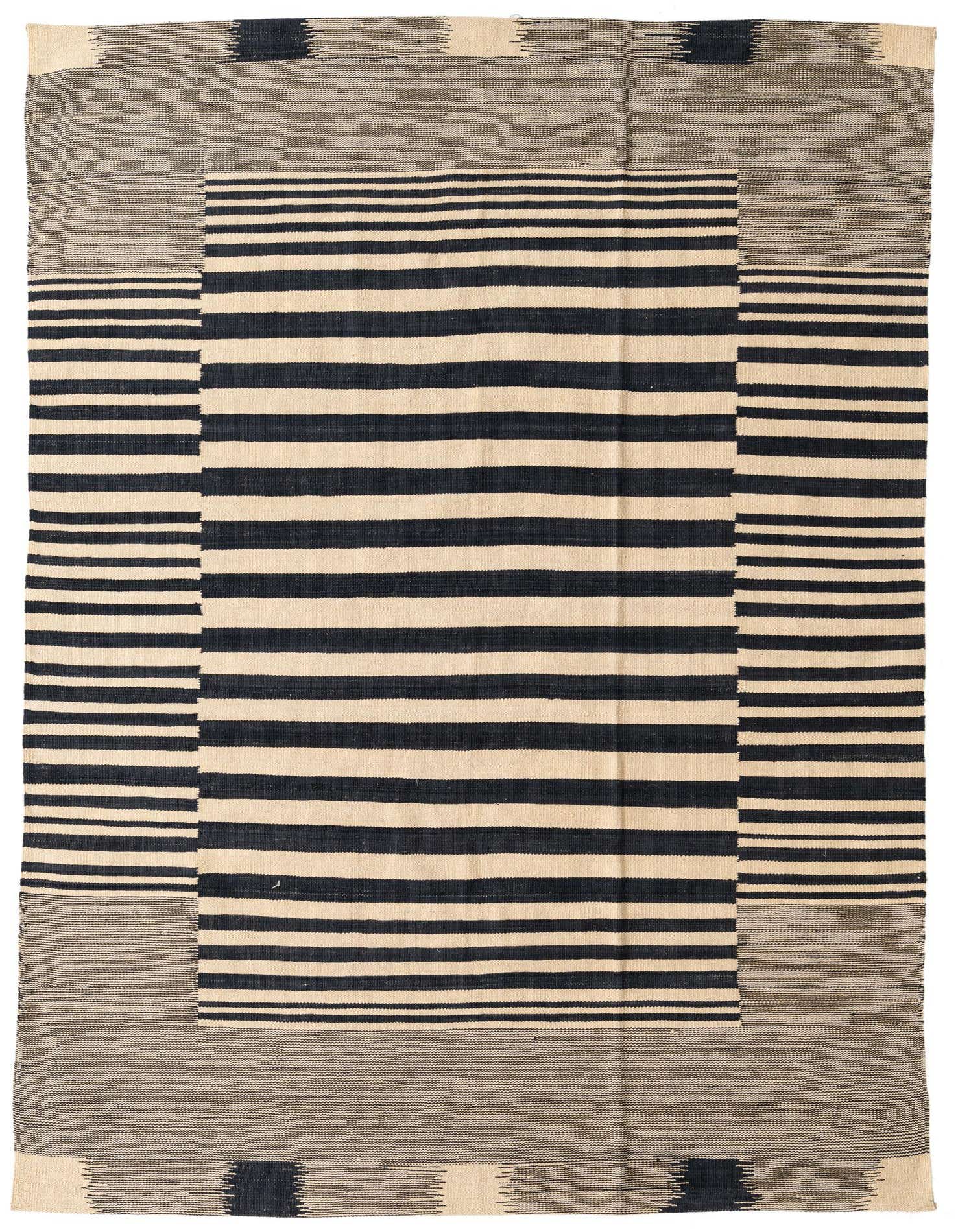 A 5x8 rectangular flatweave rug featuring a bold black and ivory stripe pattern with tribal accents, ideal for a modern living room.