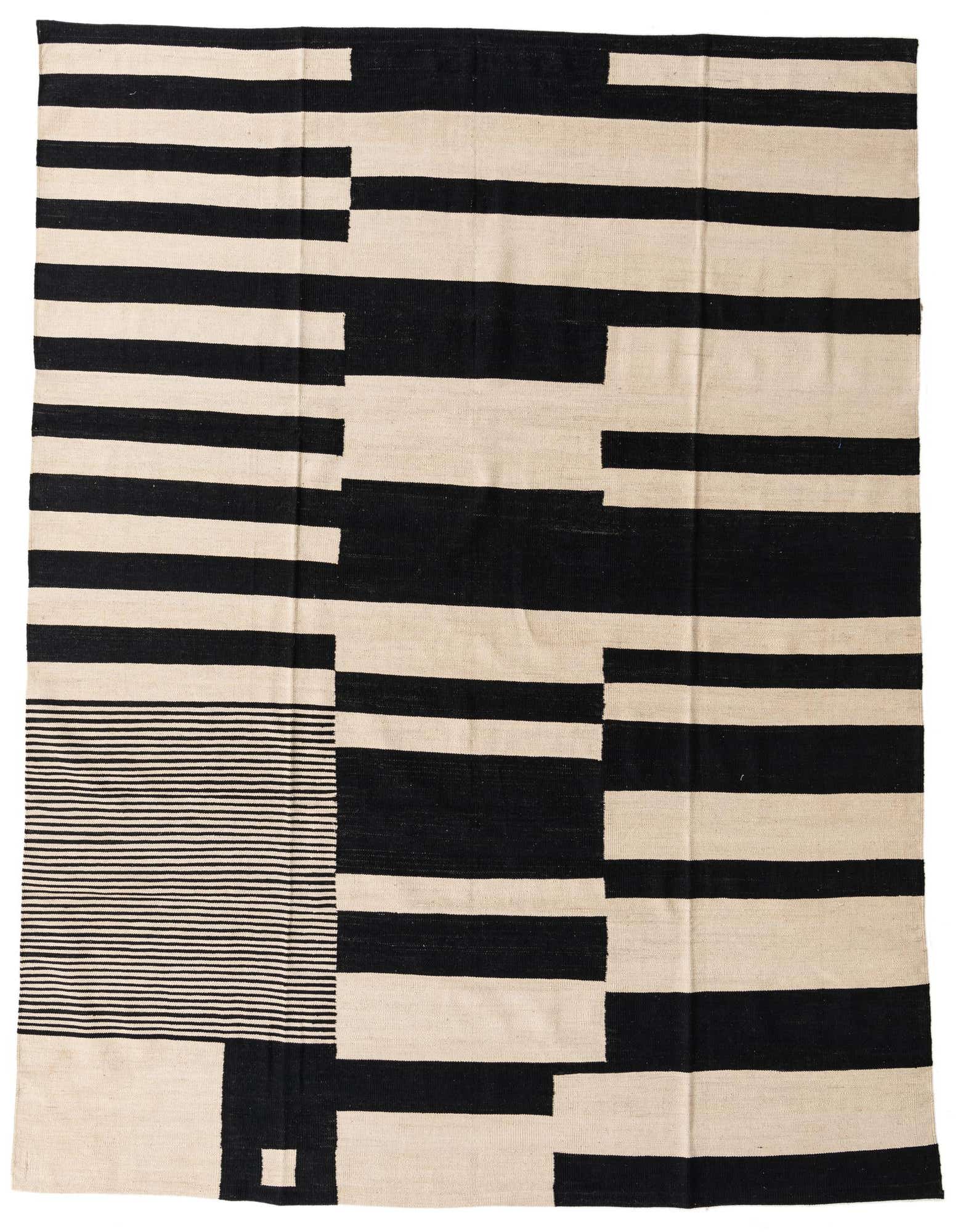 A large 8x10 rectangular flatweave rug with a bold modern abstract pattern of thick black and ivory stripes and blocks.