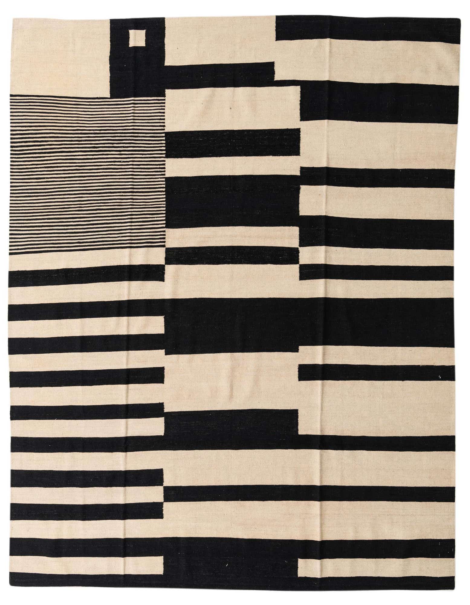 An 8x10 rectangular flatweave rug featuring a bold abstract pattern of black and ivory blocks and stripes.