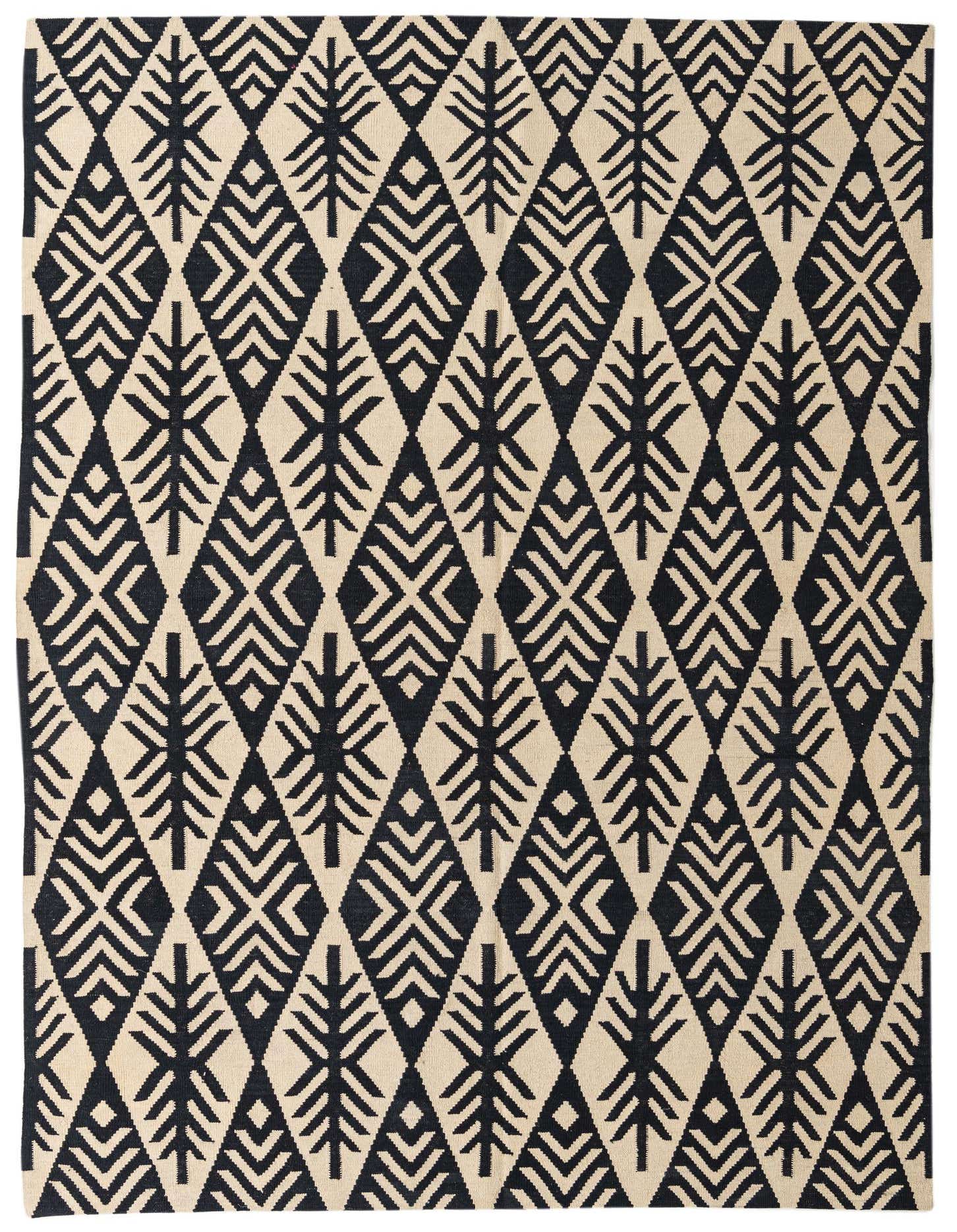 A 7x10 rectangular flatweave rug with a tribal geometric pattern in black and ivory, suitable for a living room.