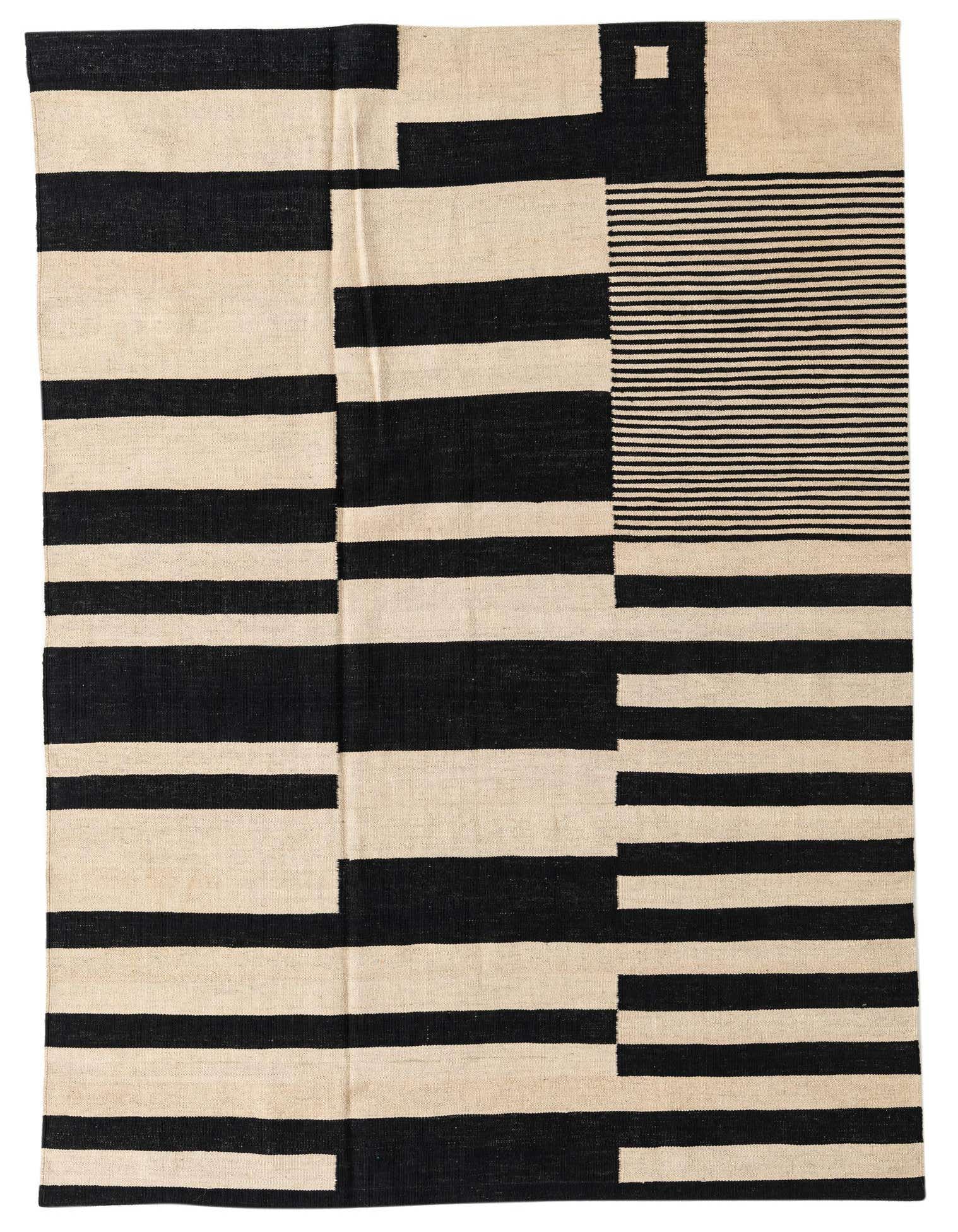 A 5x8 rectangular Kilim Modern rug with a bold black and ivory tribal stripe pattern, handmade from wool.