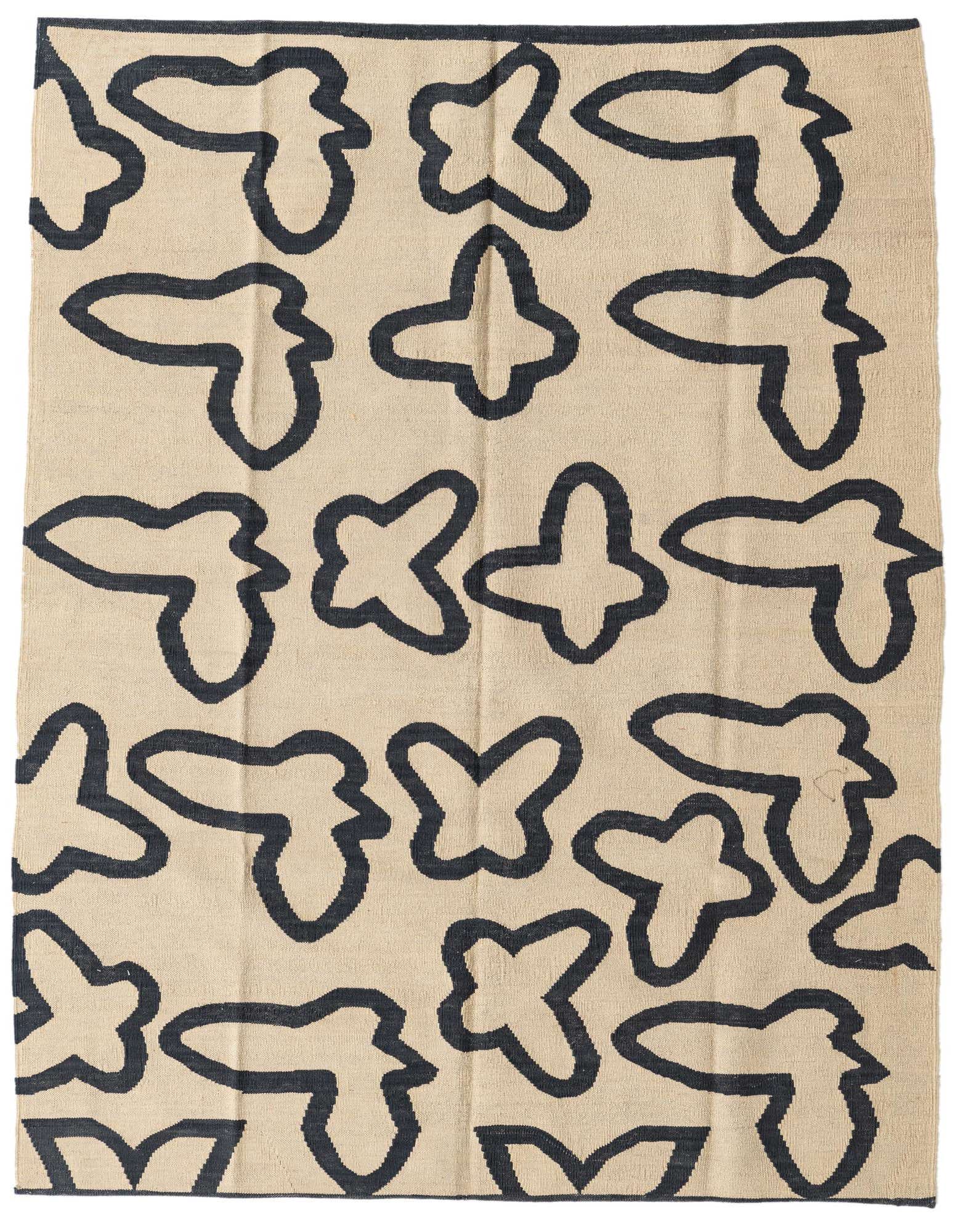 A 5x8 rectangular ivory flatweave wool rug with a modern tribal abstract pattern in black, suitable for a living room.