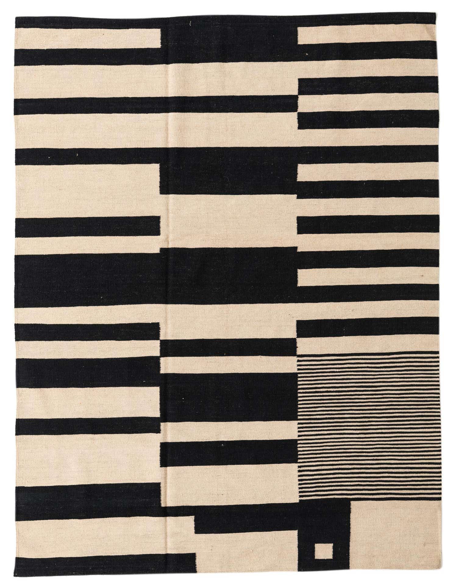 A 5x8 rectangular Kilim Modern rug with a bold, abstract tribal pattern in black and ivory, featuring thick horizontal stripes and a section of thin horizontal lines.