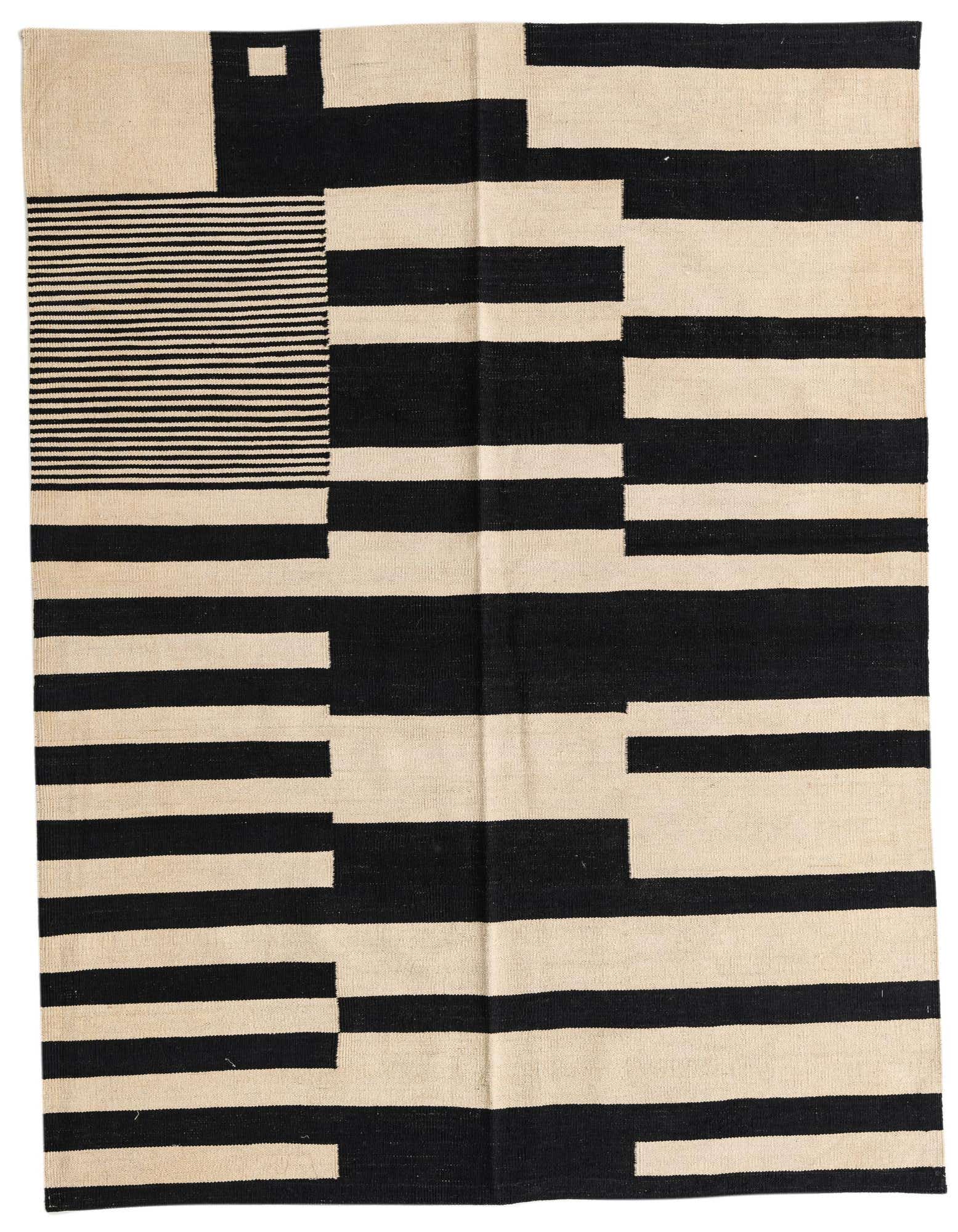 A 5x8 rectangular Kilim Modern rug with a bold abstract pattern of black and ivory stripes and blocks.