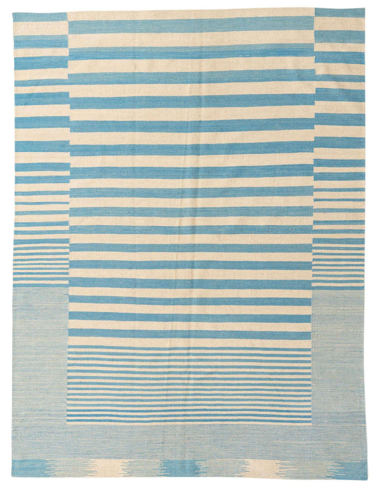 A 5x8 rectangular ivory and light blue striped flatweave rug with a tribal border pattern, suitable for a living room.