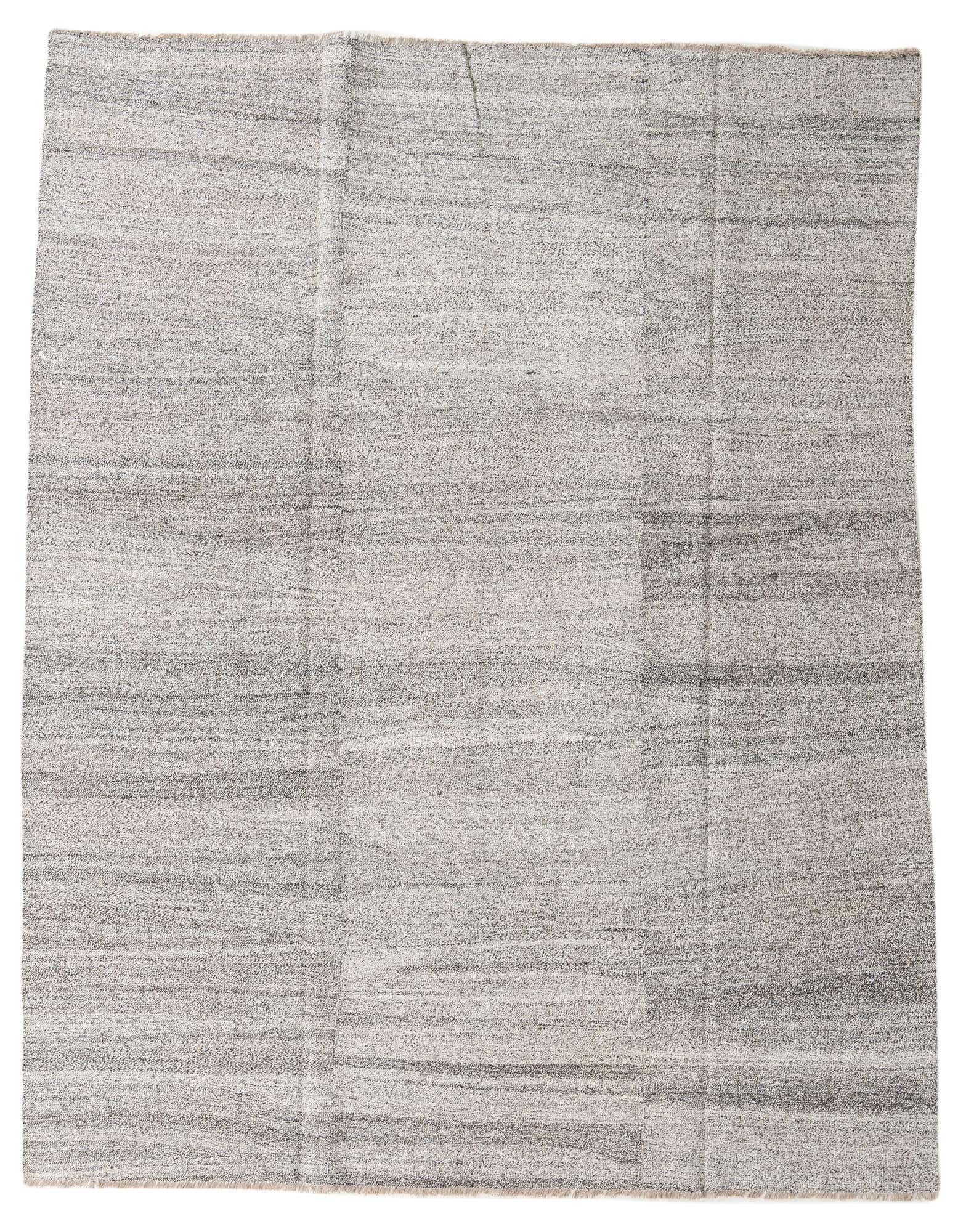 An 8x10 rectangular flatweave wool rug featuring an abstract tribal pattern in shades of ivory and cream, suitable for a living room.