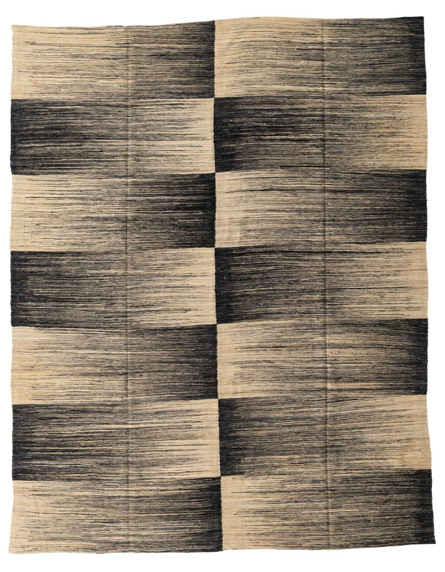 An 8x10 rectangular flatweave rug featuring a modern tribal pattern in ivory and black, ideal for a living room.