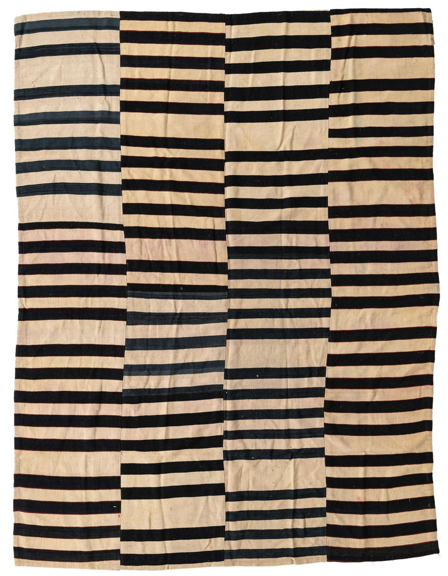 A 5x8 rectangular Kilim Modern rug with a tribal abstract pattern of ivory and black horizontal stripes.