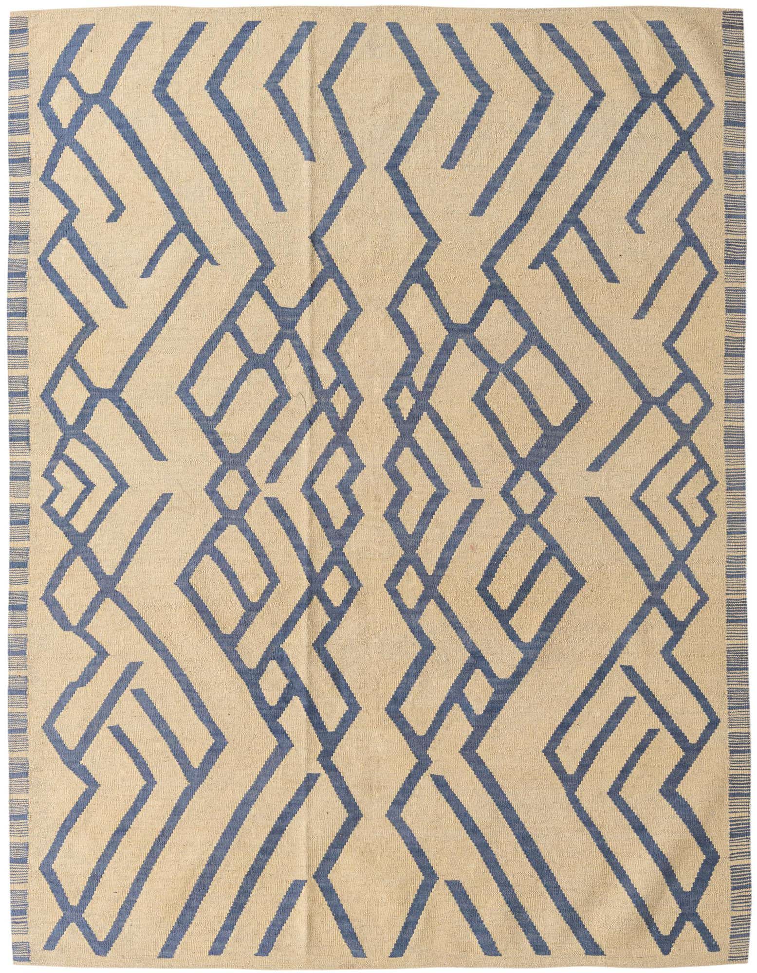 A 6x9 rectangular ivory flatweave rug with a bold blue tribal geometric pattern and striped border.