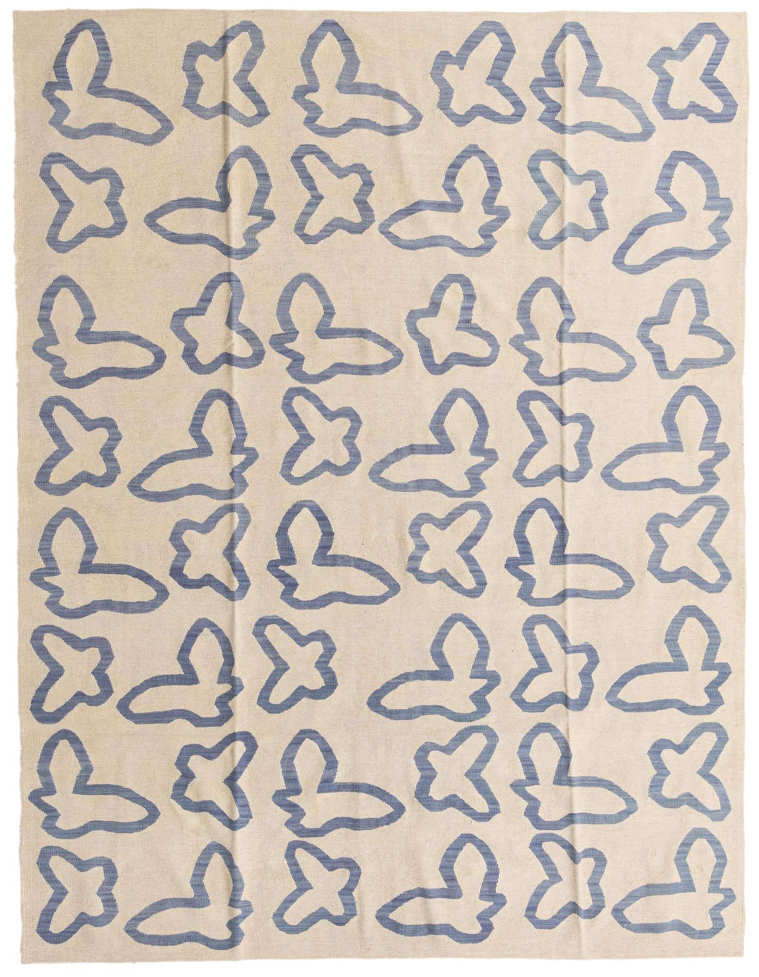 An 8x10 rectangular ivory flatweave rug with a repeating abstract blue tribal pattern, suitable for a modern living room.