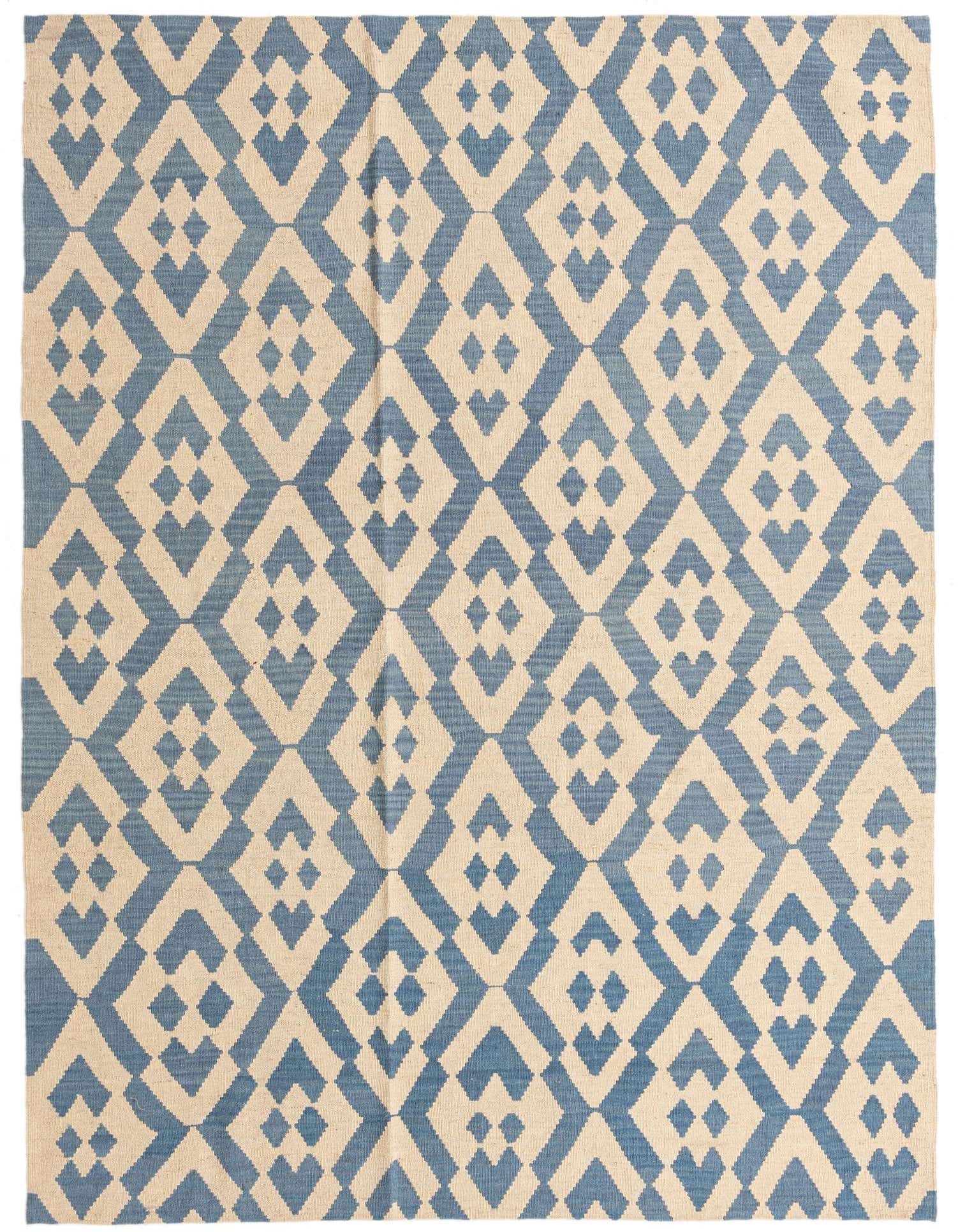 A 6x9 rectangular Kilim Modern rug with a flatweave, featuring an ivory and blue tribal geometric pattern.