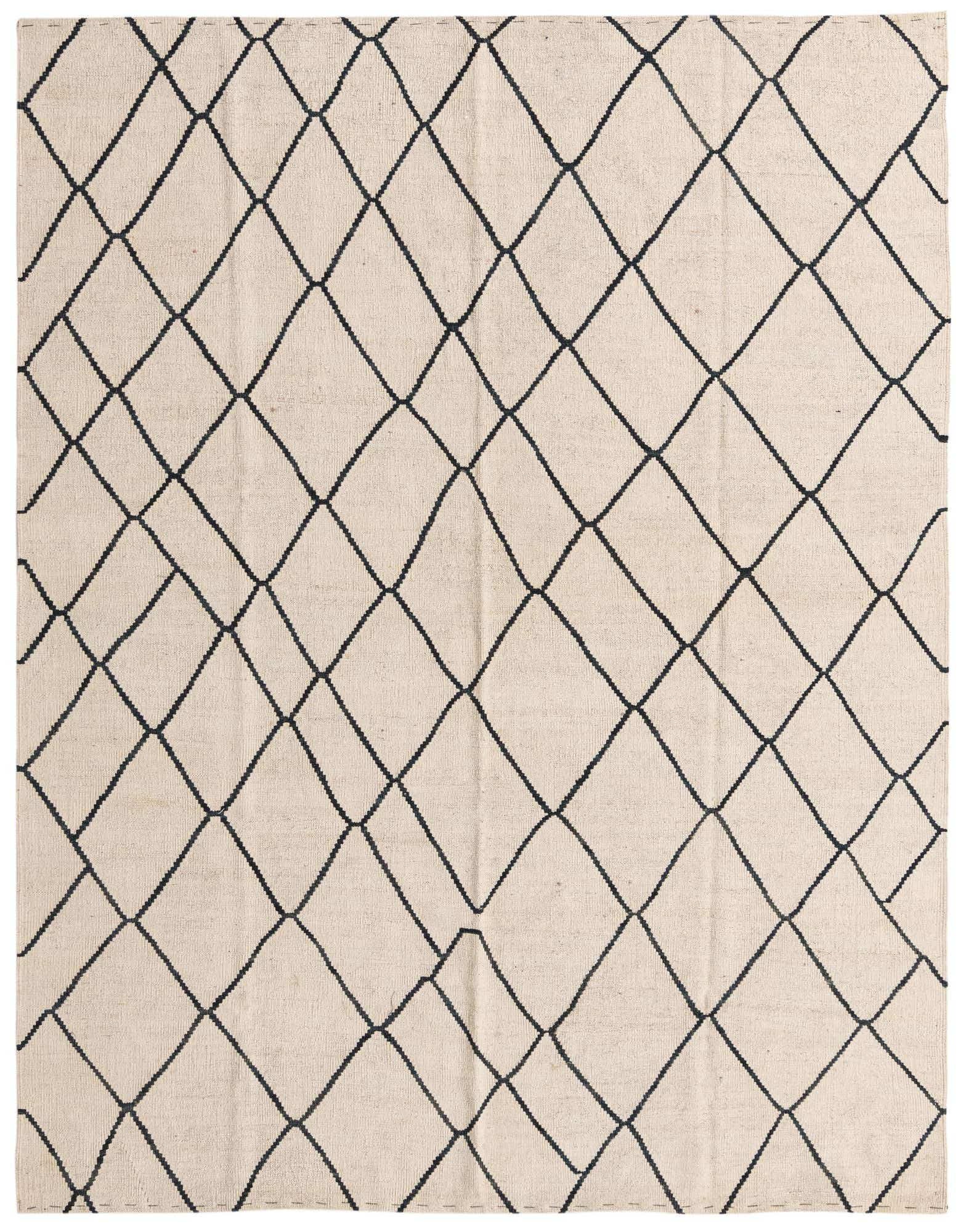 A 6x9 rectangular ivory flatweave wool rug with a black tribal diamond pattern, suitable for a living room.