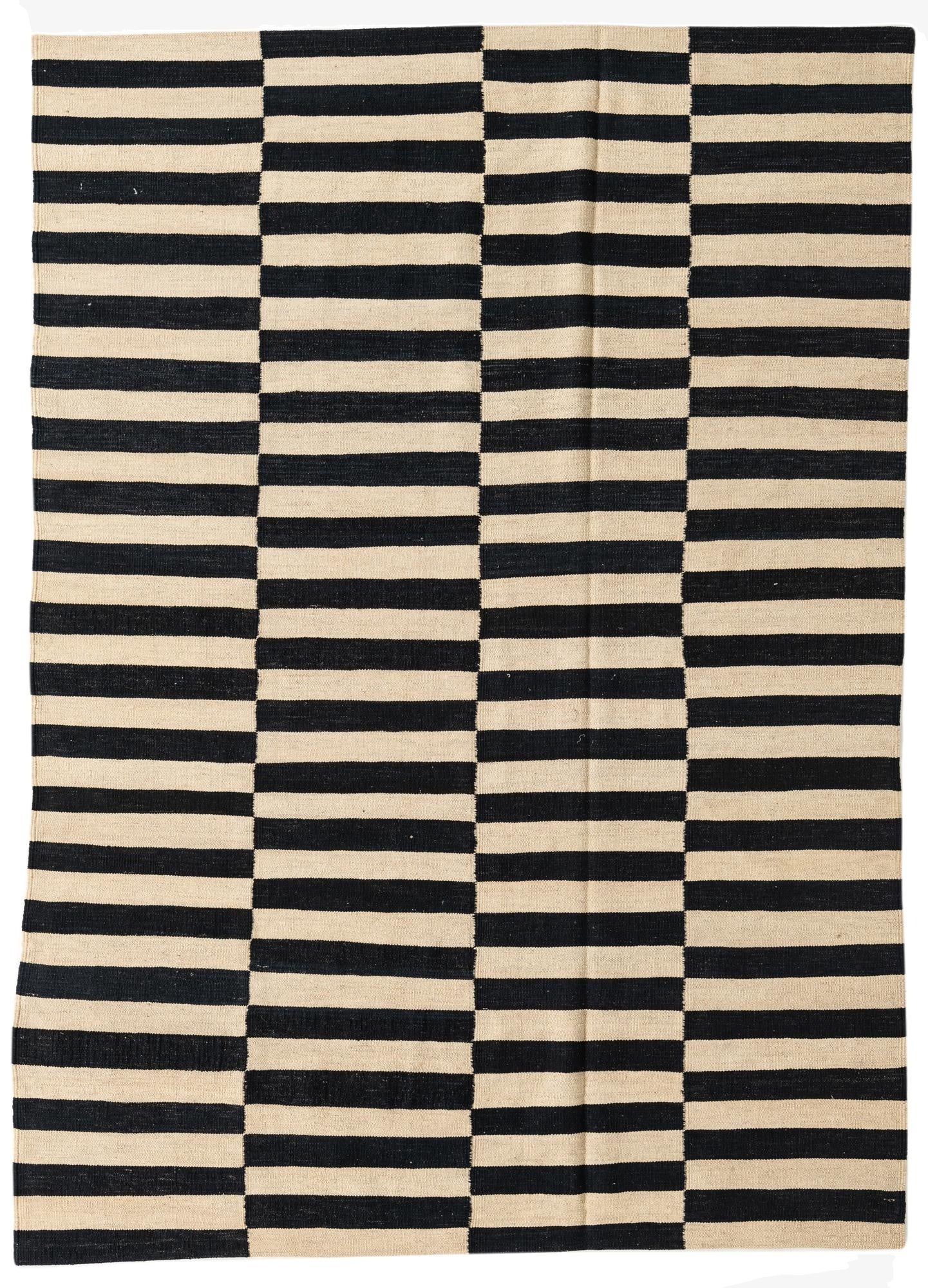 A 5x8 rectangular Kilim Modern rug with a bold black and ivory striped pattern, perfect for a living room.