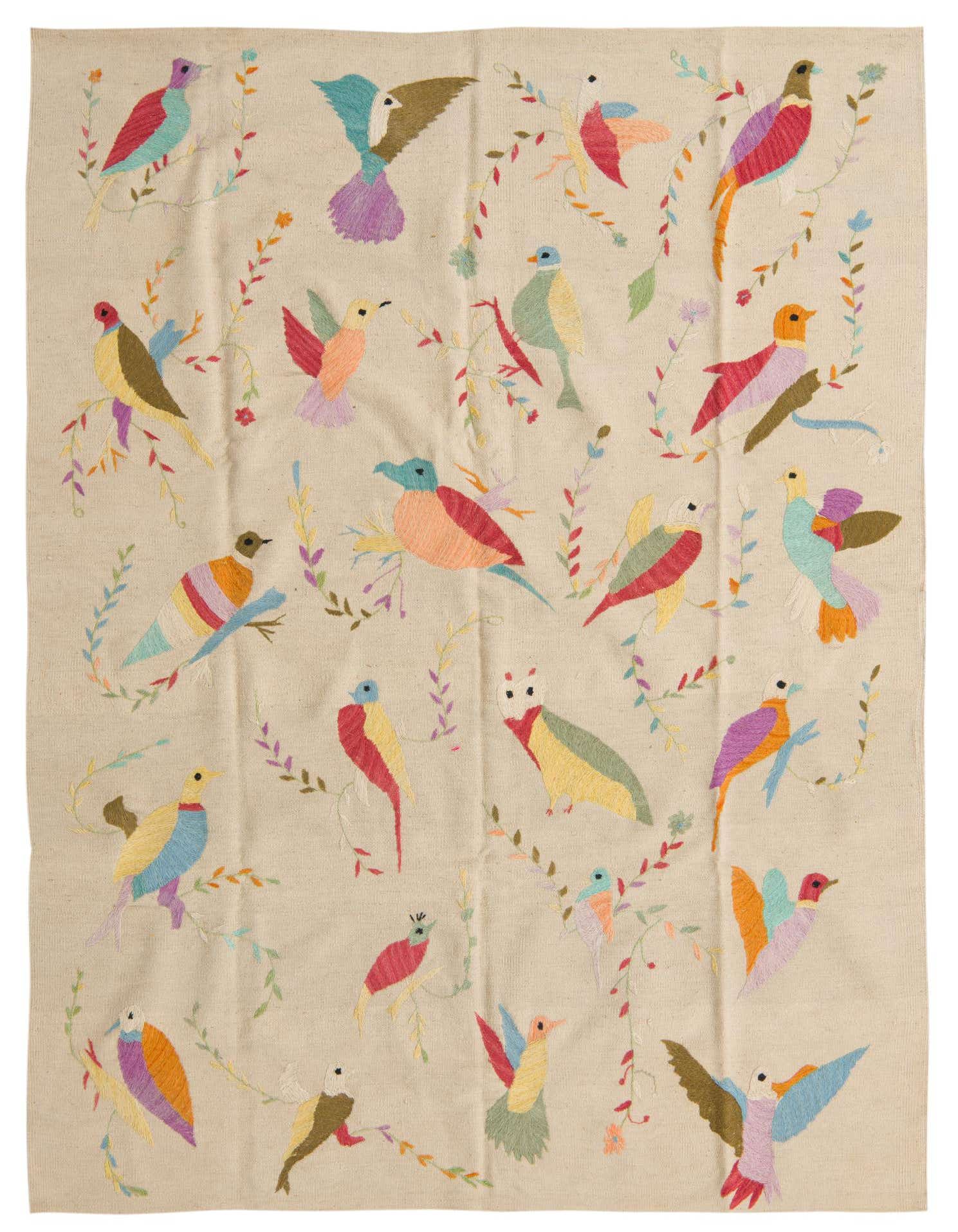 A 5x8 rectangular ivory flatweave rug featuring a vibrant, multicolored bird and floral Suzani pattern.