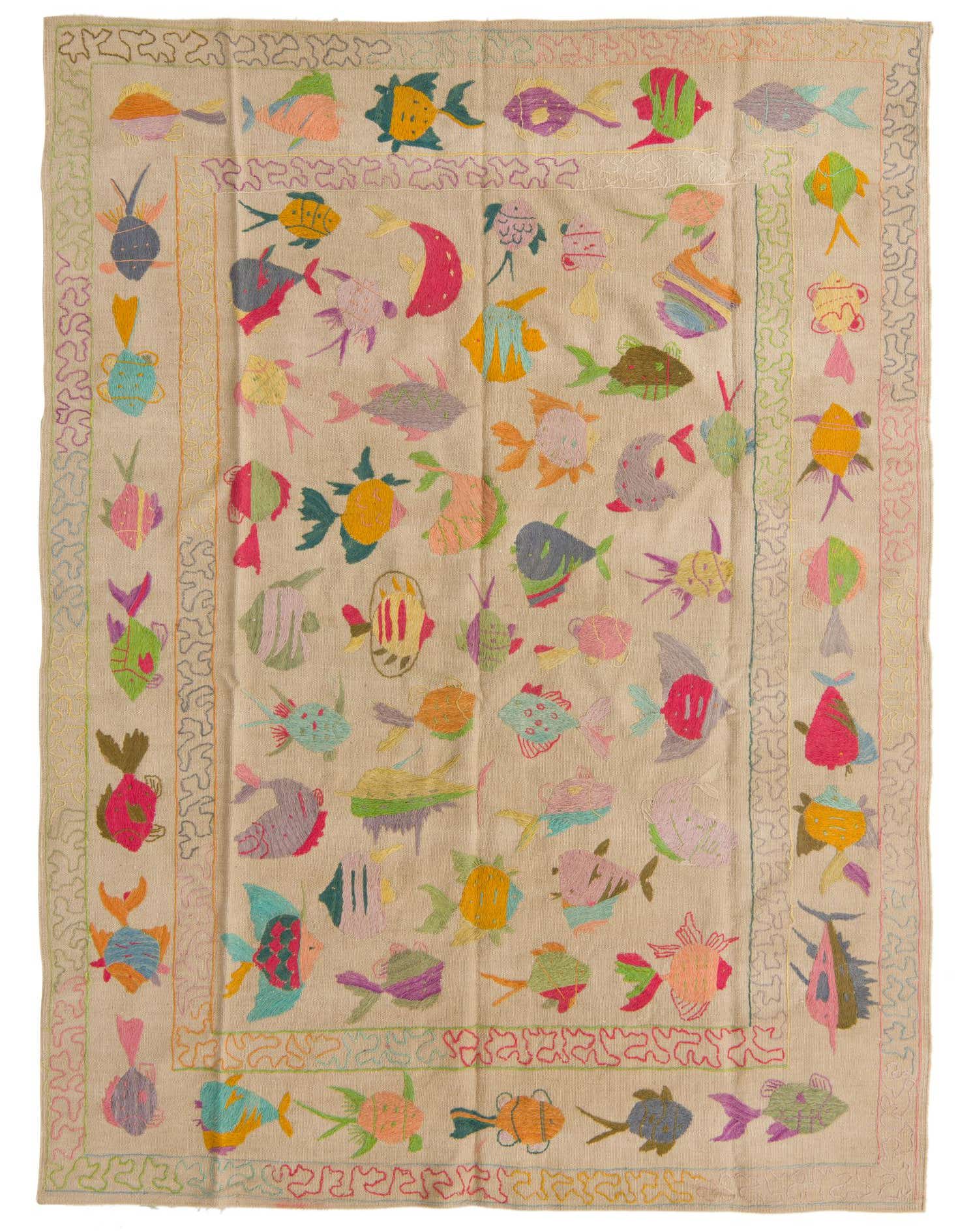 A 5x8 rectangular ivory flatweave rug with a colorful, whimsical fish pattern and a decorative border, perfect for a child's room or playful space.