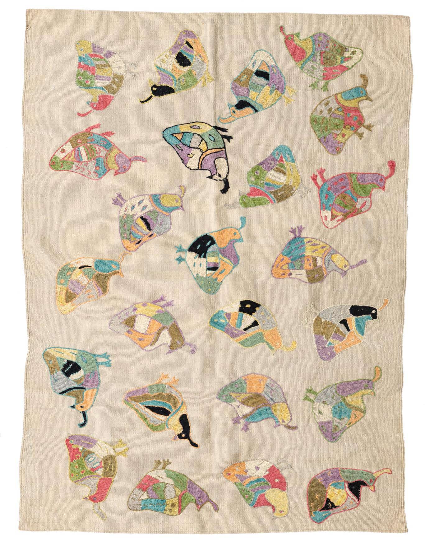 A 4x6 rectangular ivory flatweave wool rug with colorful tribal butterfly-like patterns, perfect for a living room.